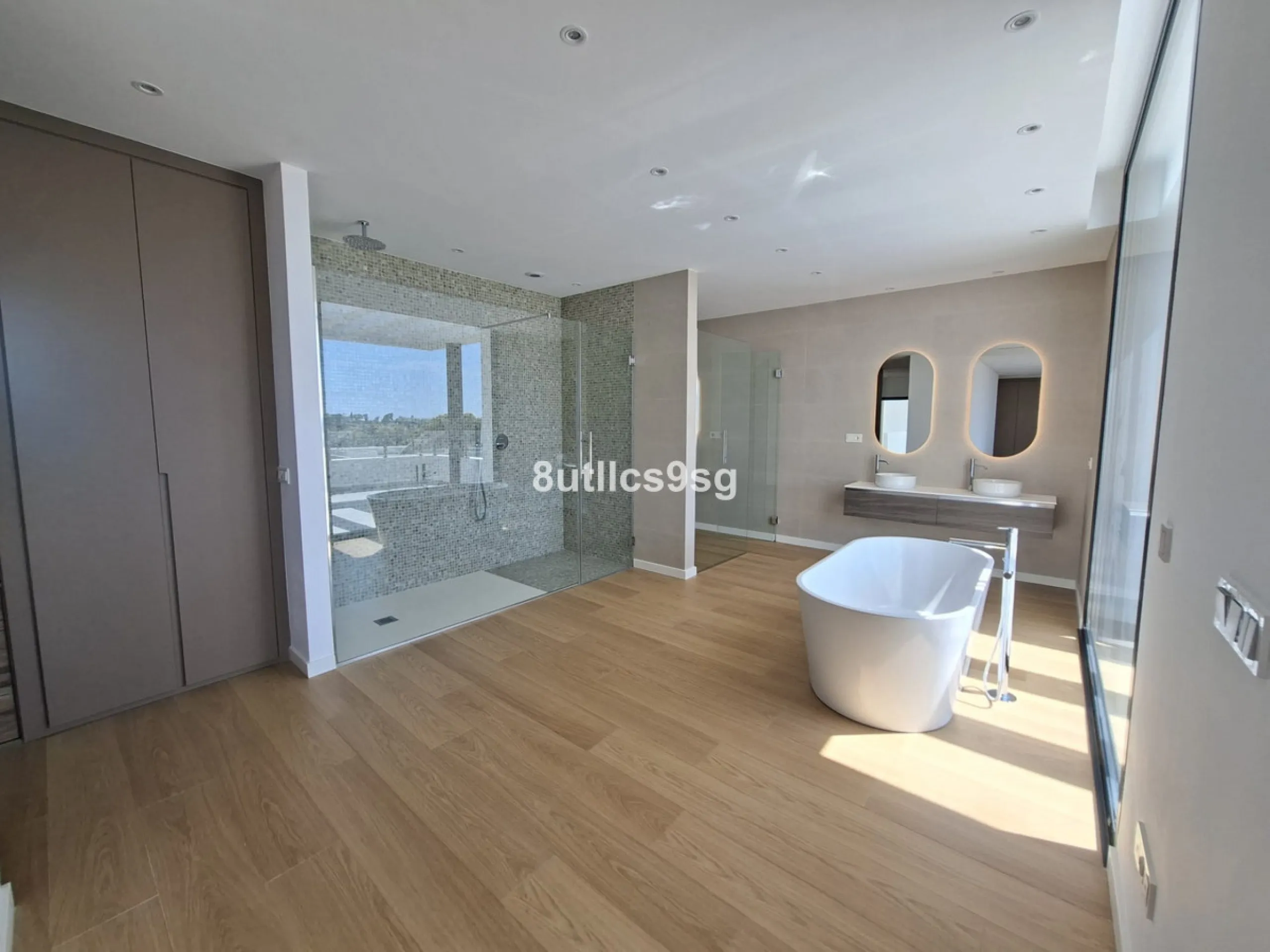 This contemporary villa is situated in the sought-after area of Paraiso Alto, Benahavis, Malaga. The property offers six bedrooms and eight bathrooms, including six en-suite, and stands out for its generous proportions with a built area of 1,038m² and a p