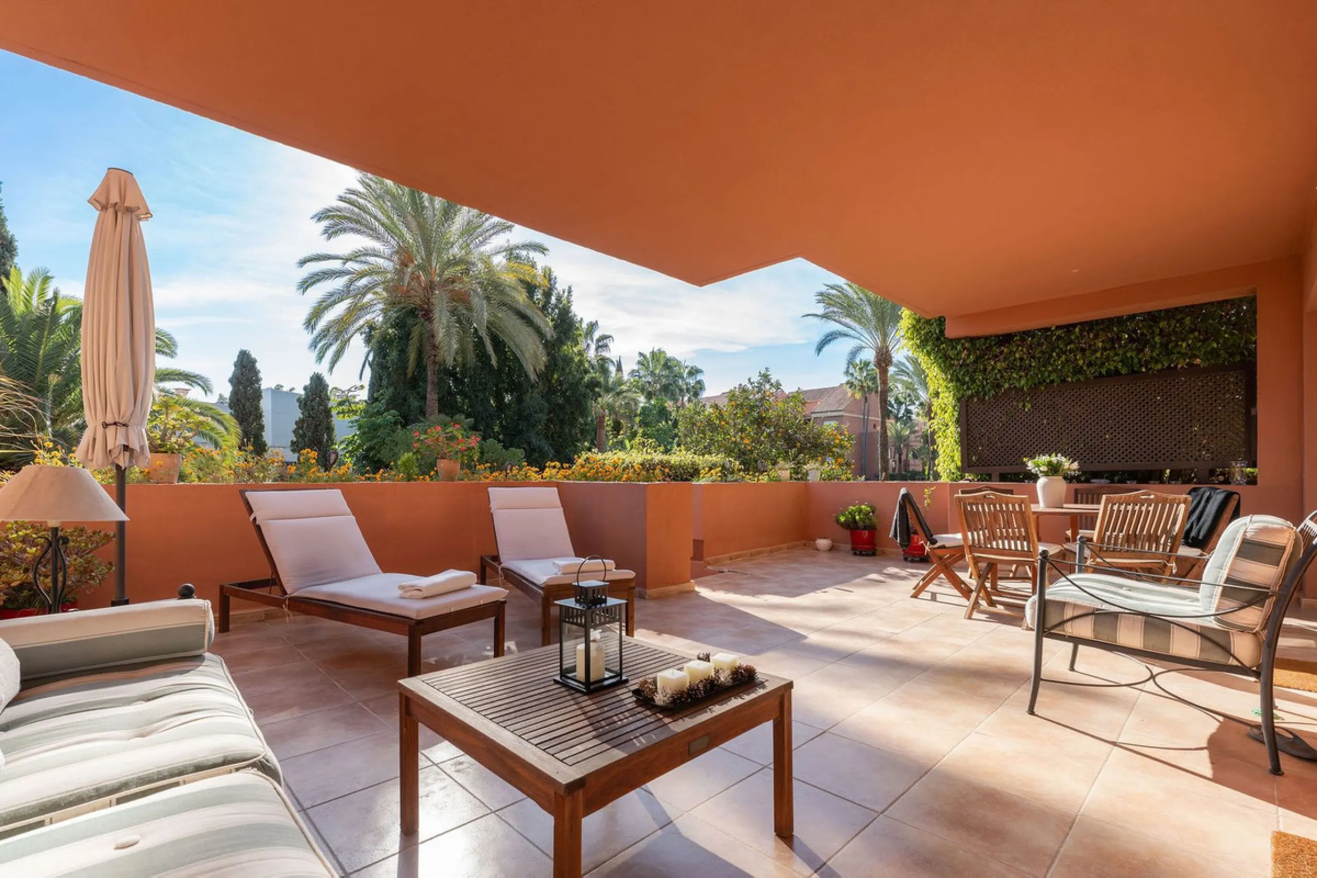 Just a short walk from the beach, this spacious two-bedroom apartment offers direct access to the beautifully maintained garden and swimming pool via a wide private terrace.
