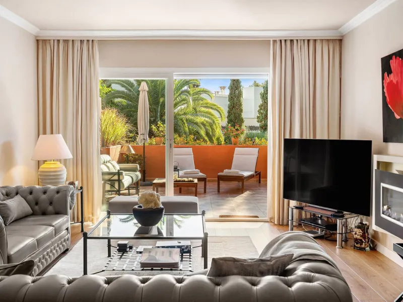 Just a short walk from the beach, this spacious two-bedroom apartment offers direct access to the beautifully maintained garden and swimming pool via a wide private terrace.