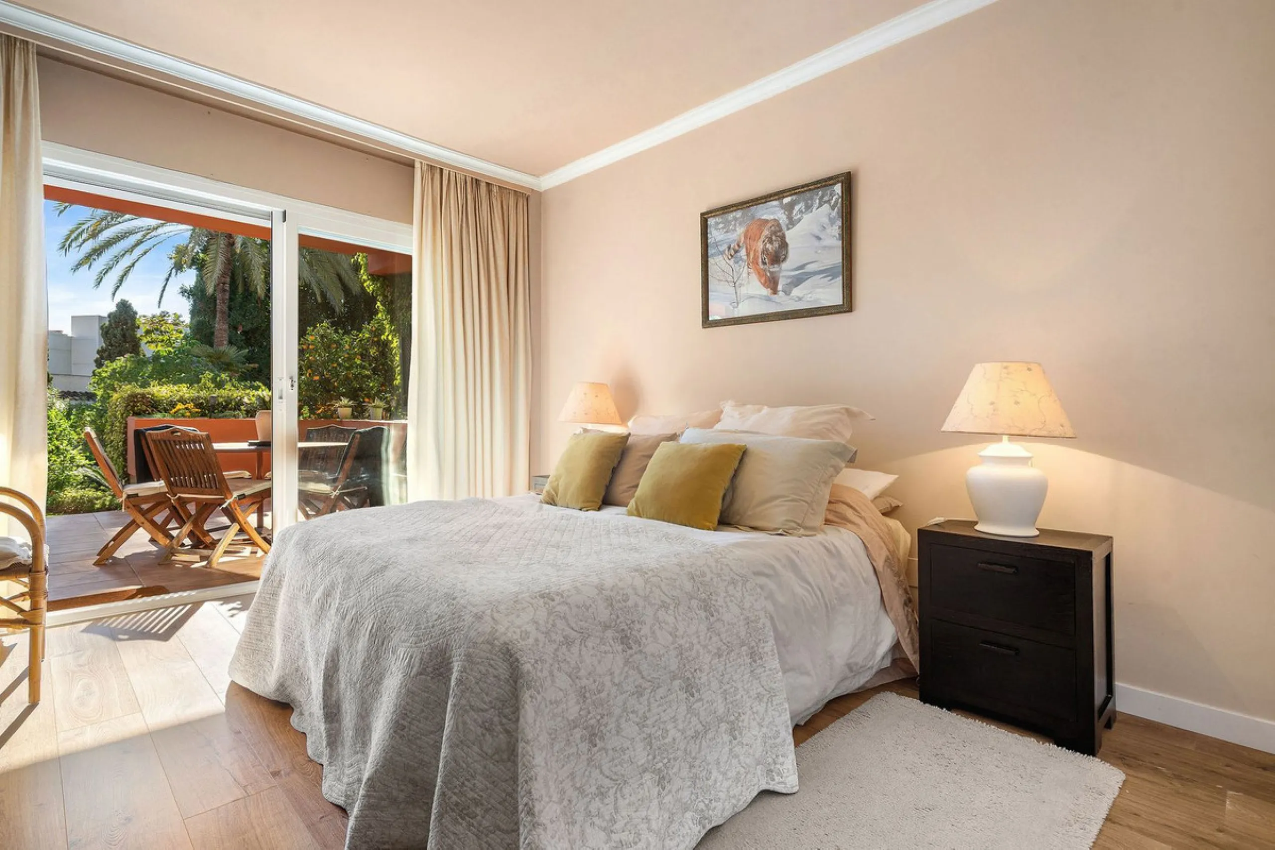 Just a short walk from the beach, this spacious two-bedroom apartment offers direct access to the beautifully maintained garden and swimming pool via a wide private terrace.