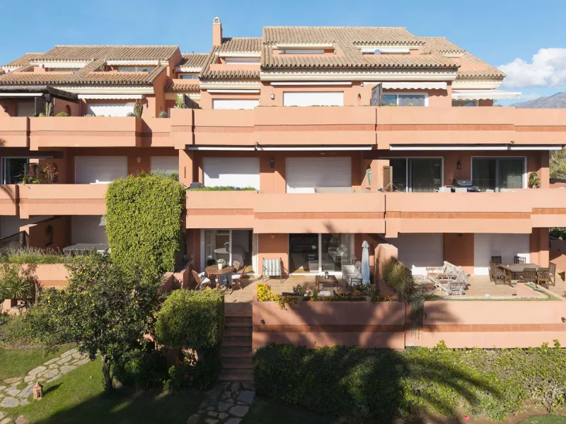 Just a short walk from the beach, this spacious two-bedroom apartment offers direct access to the beautifully maintained garden and swimming pool via a wide private terrace.