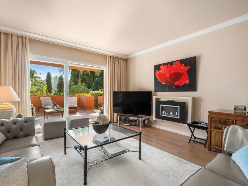 Just a short walk from the beach, this spacious two-bedroom apartment offers direct access to the beautifully maintained garden and swimming pool via a wide private terrace.