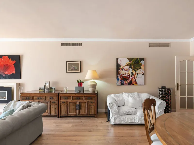 Just a short walk from the beach, this spacious two-bedroom apartment offers direct access to the beautifully maintained garden and swimming pool via a wide private terrace.