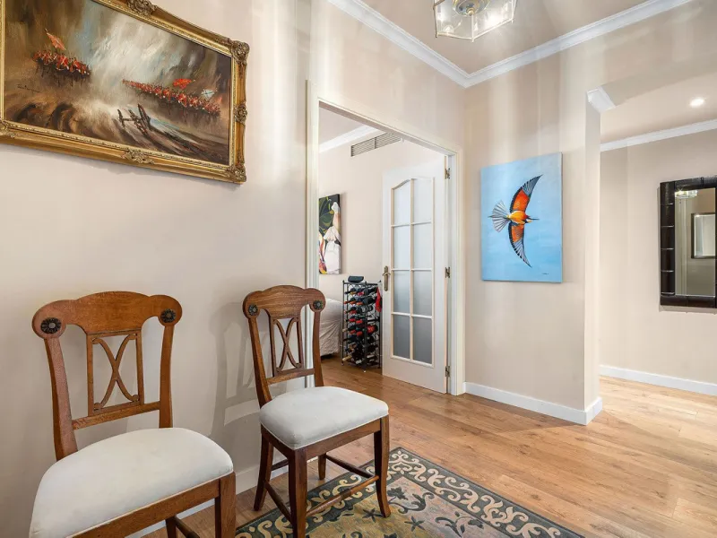 Just a short walk from the beach, this spacious two-bedroom apartment offers direct access to the beautifully maintained garden and swimming pool via a wide private terrace.