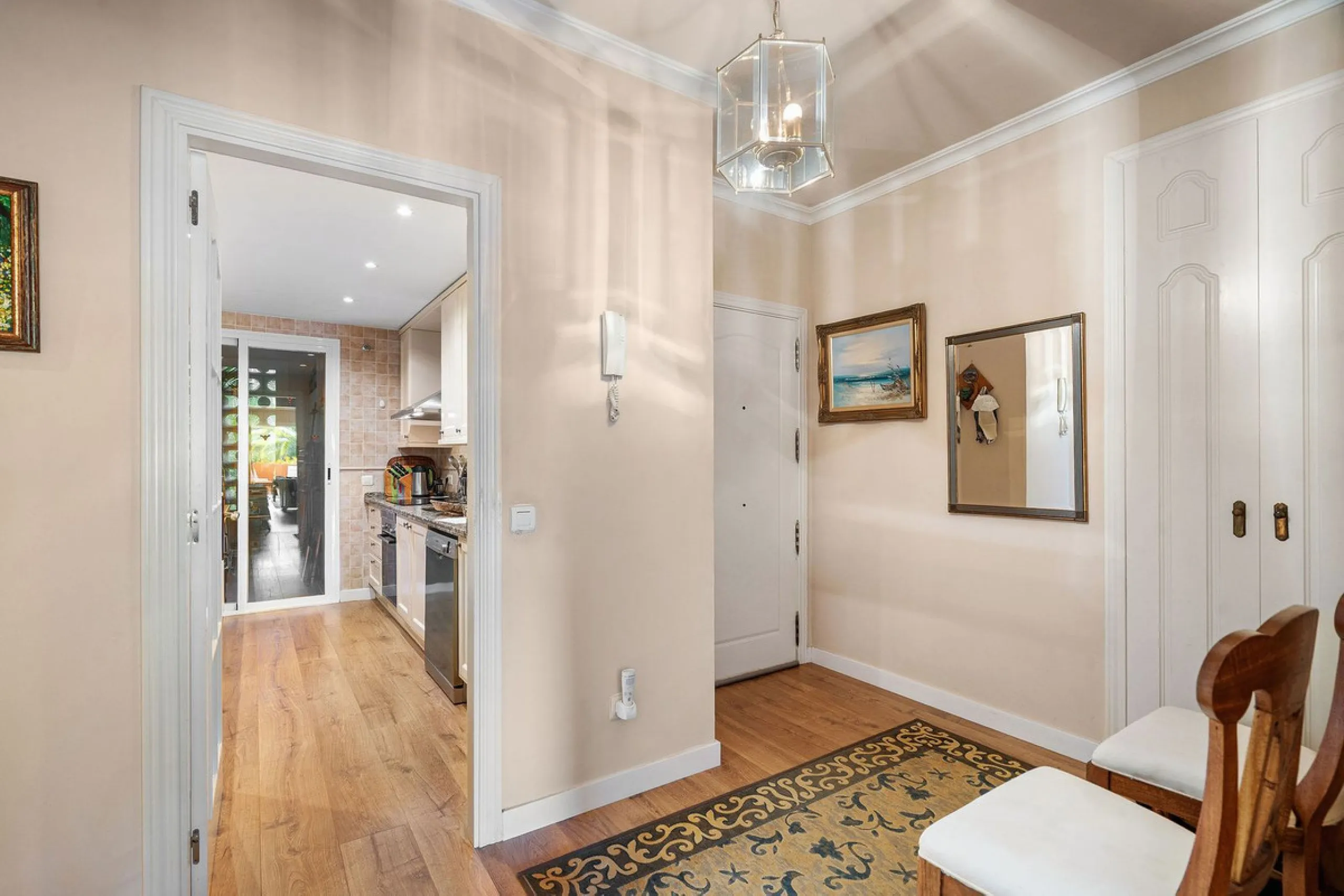 Just a short walk from the beach, this spacious two-bedroom apartment offers direct access to the beautifully maintained garden and swimming pool via a wide private terrace.