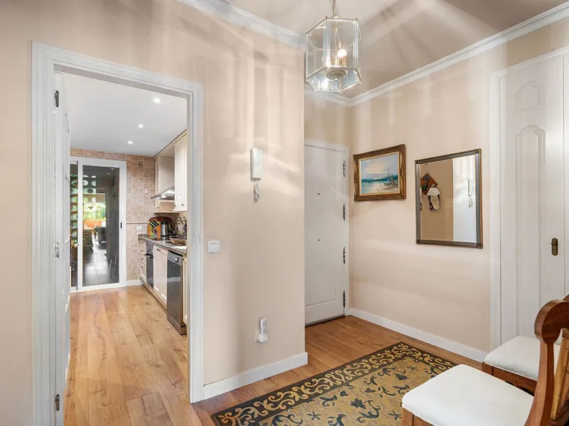 Just a short walk from the beach, this spacious two-bedroom apartment offers direct access to the beautifully maintained garden and swimming pool via a wide private terrace.