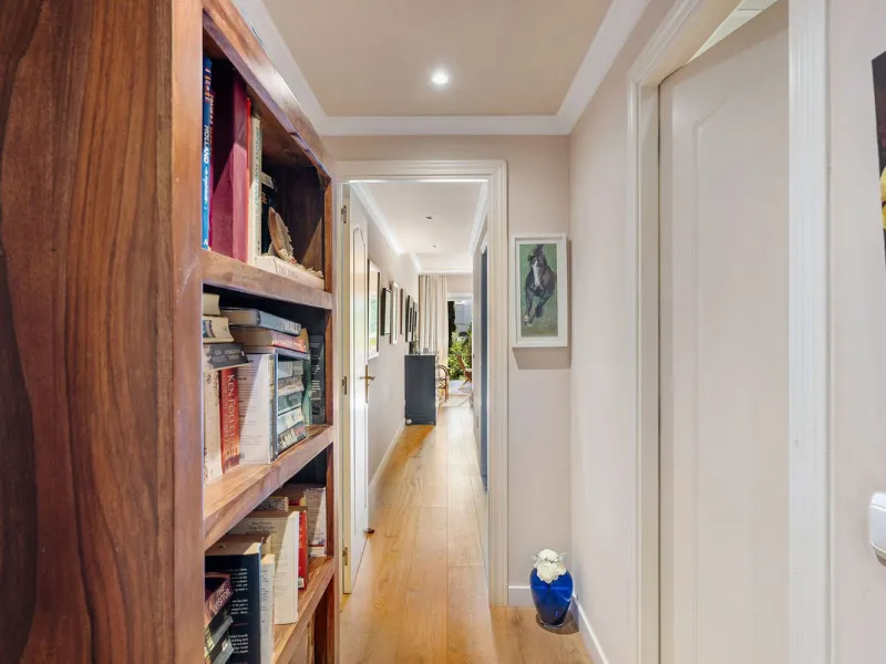 Just a short walk from the beach, this spacious two-bedroom apartment offers direct access to the beautifully maintained garden and swimming pool via a wide private terrace.