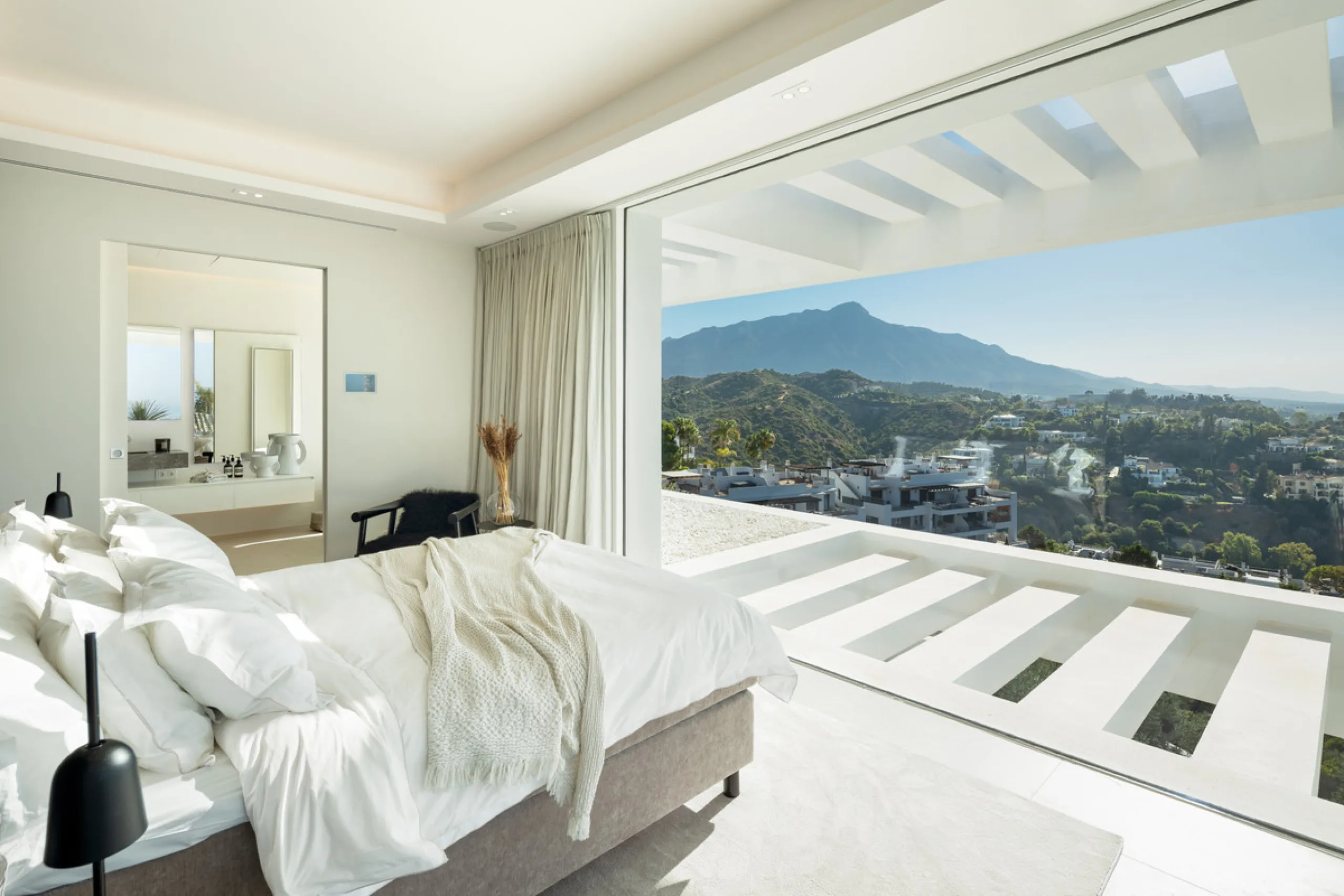Nestled in the serene enclave of La Quinta, this contemporary villa, built in 2021, is designed to capture the essence of luxury living. South-facing, it offers stunning, sweeping views from the impressive La Concha Mountain to the Mediterranean Sea and e