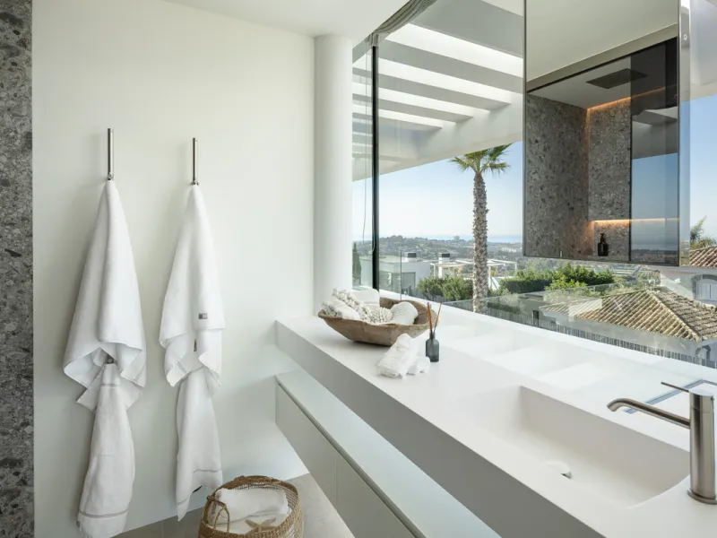 Nestled in the serene enclave of La Quinta, this contemporary villa, built in 2021, is designed to capture the essence of luxury living. South-facing, it offers stunning, sweeping views from the impressive La Concha Mountain to the Mediterranean Sea and e