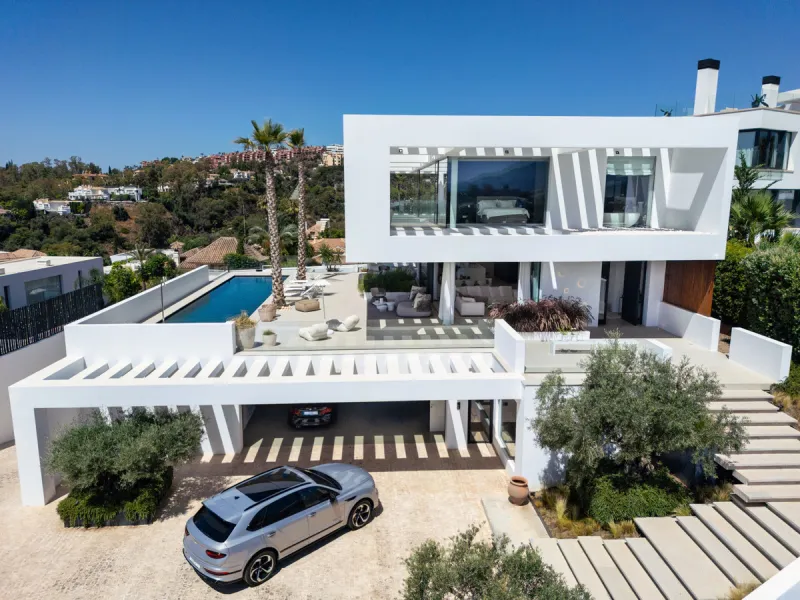 Nestled in the serene enclave of La Quinta, this contemporary villa, built in 2021, is designed to capture the essence of luxury living. South-facing, it offers stunning, sweeping views from the impressive La Concha Mountain to the Mediterranean Sea and e