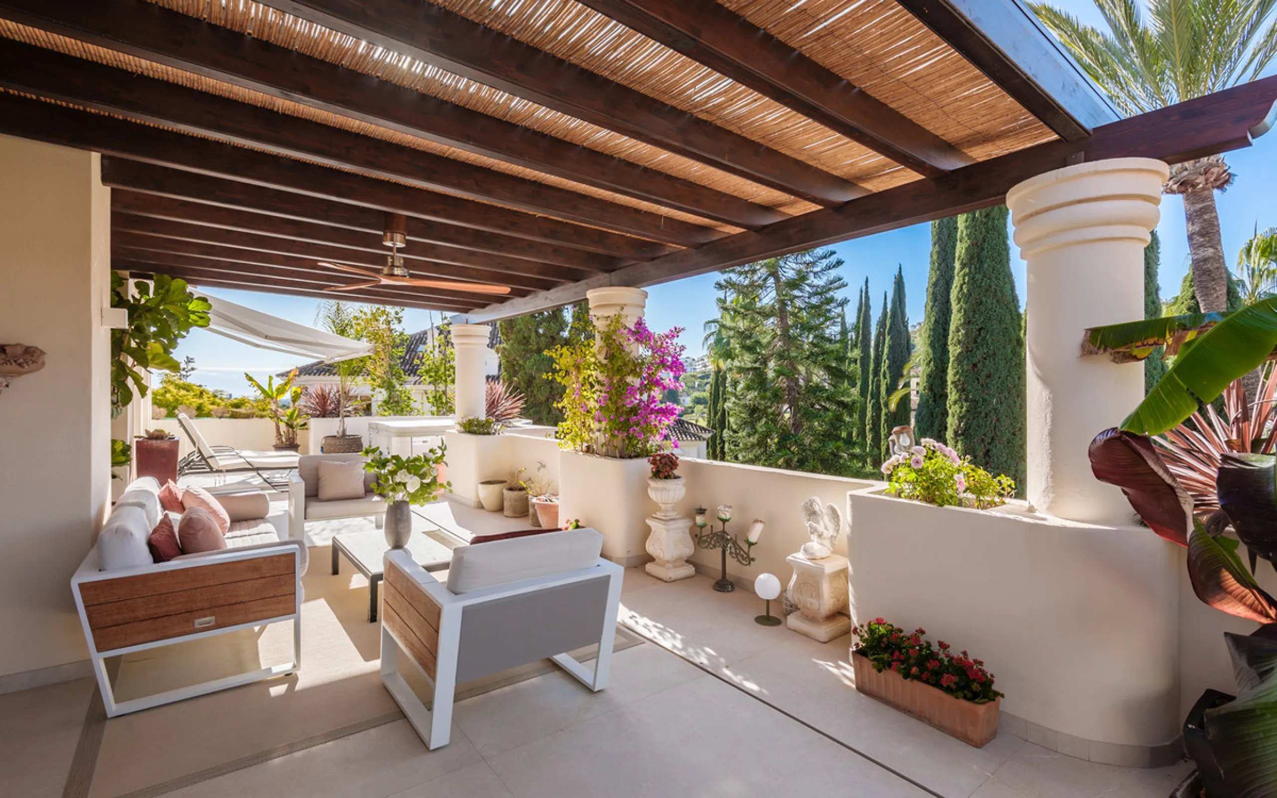 This exceptional and exquisitely designed southwest-facing duplex penthouse offers a stunning panoramic view of the award-winning gardens of Las Alamandas, in Nueva Andalucía, providing an ideal balance of sun and shade across its expansive terrace spaces