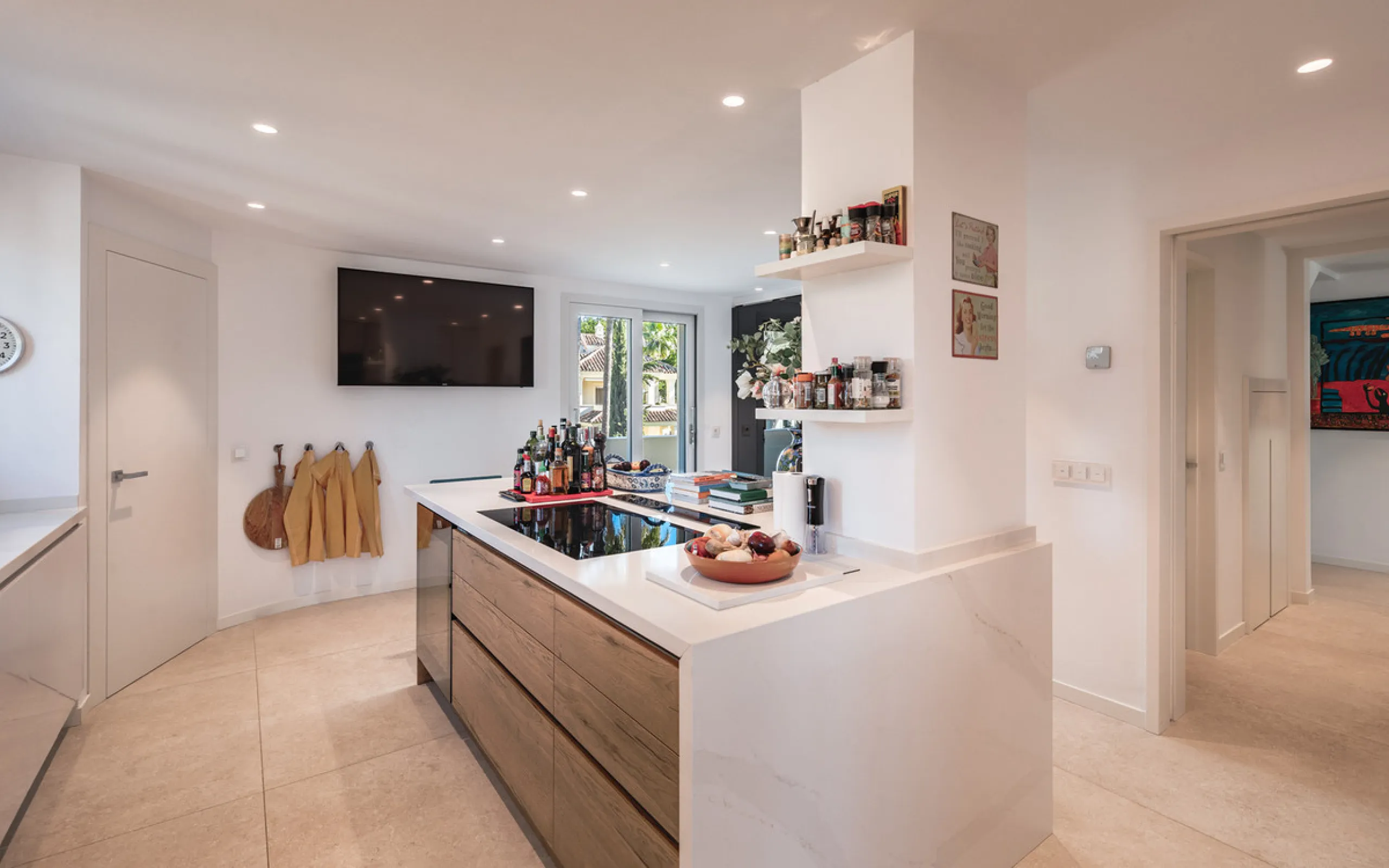 This exceptional and exquisitely designed southwest-facing duplex penthouse offers a stunning panoramic view of the award-winning gardens of Las Alamandas, in Nueva Andalucía, providing an ideal balance of sun and shade across its expansive terrace spaces