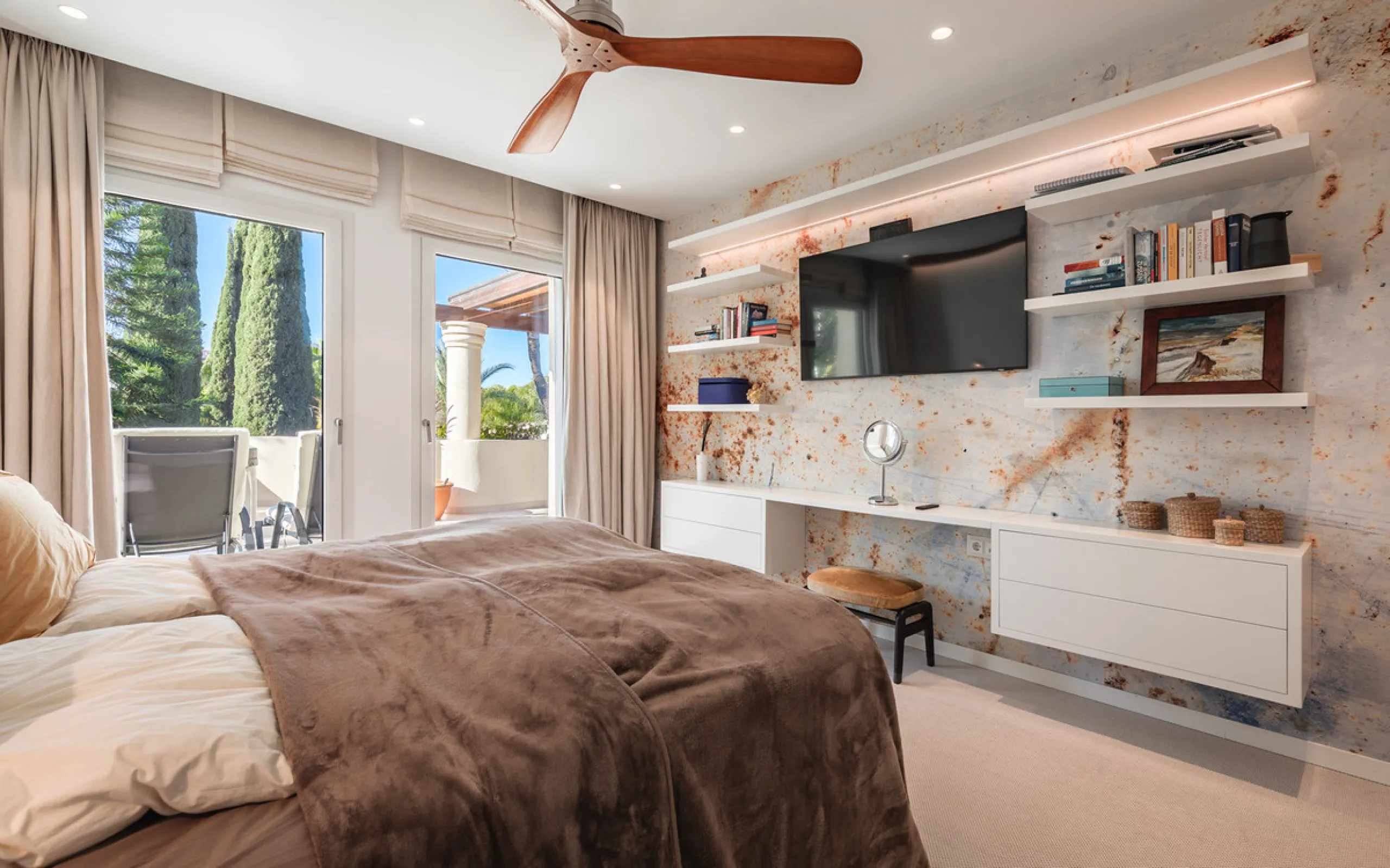 This exceptional and exquisitely designed southwest-facing duplex penthouse offers a stunning panoramic view of the award-winning gardens of Las Alamandas, in Nueva Andalucía, providing an ideal balance of sun and shade across its expansive terrace spaces