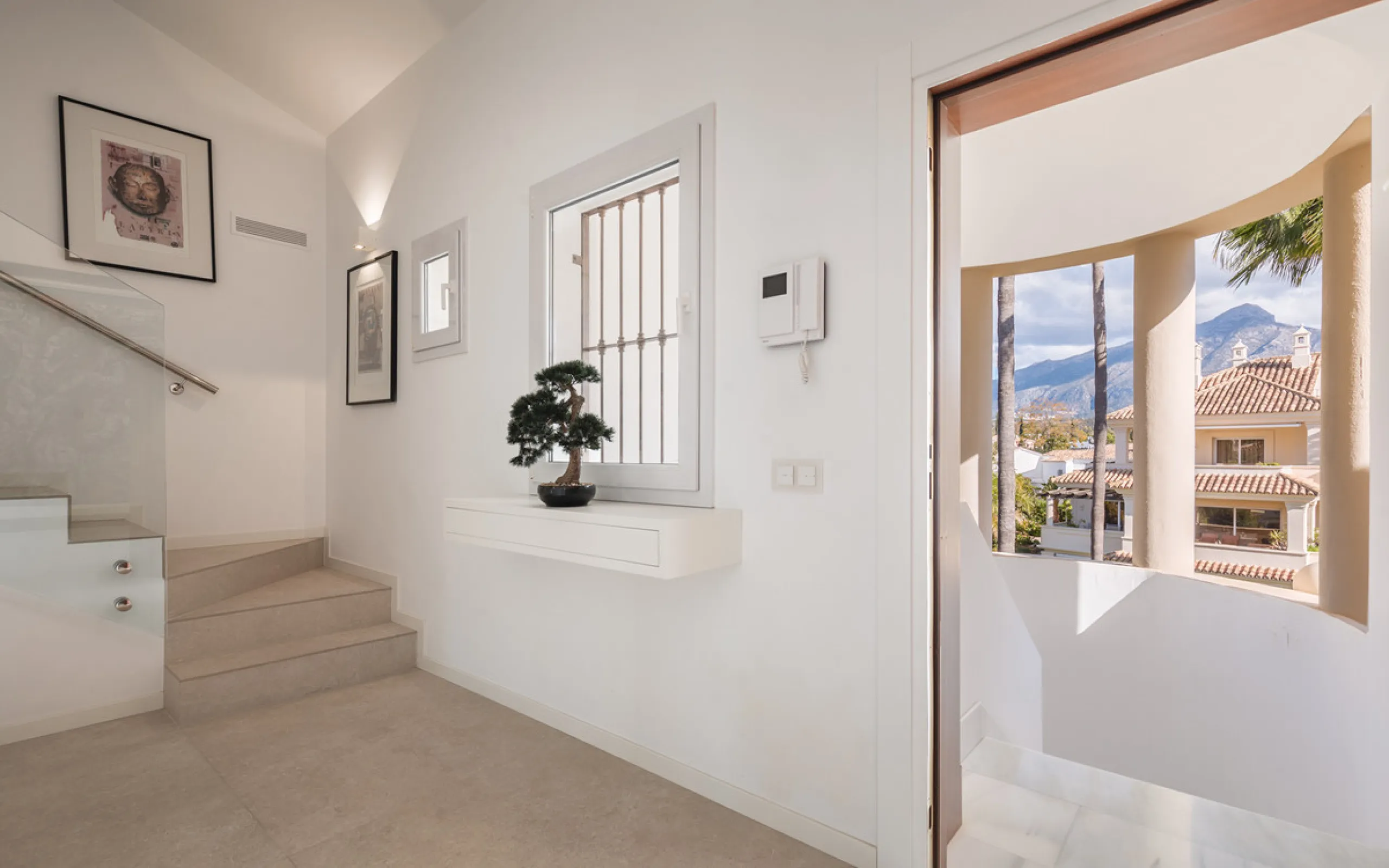 This exceptional and exquisitely designed southwest-facing duplex penthouse offers a stunning panoramic view of the award-winning gardens of Las Alamandas, in Nueva Andalucía, providing an ideal balance of sun and shade across its expansive terrace spaces
