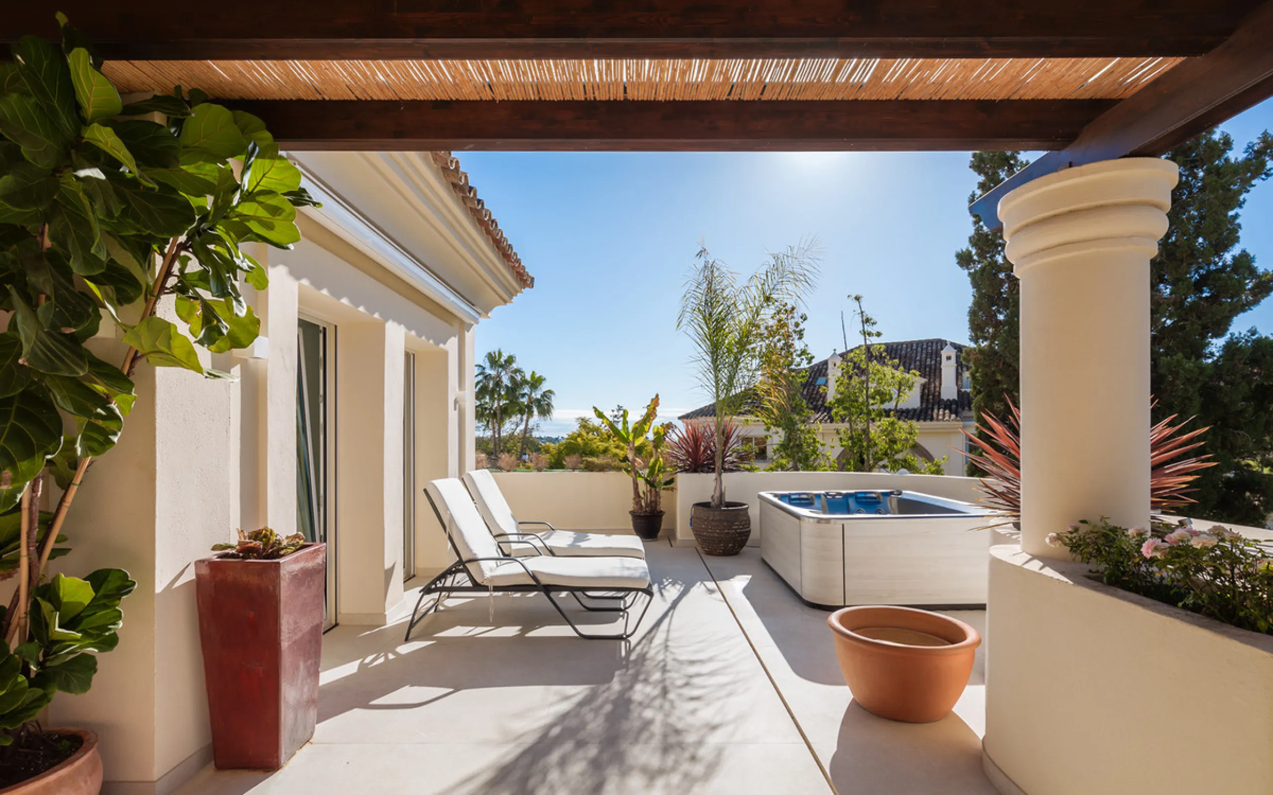 This exceptional and exquisitely designed southwest-facing duplex penthouse offers a stunning panoramic view of the award-winning gardens of Las Alamandas, in Nueva Andalucía, providing an ideal balance of sun and shade across its expansive terrace spaces