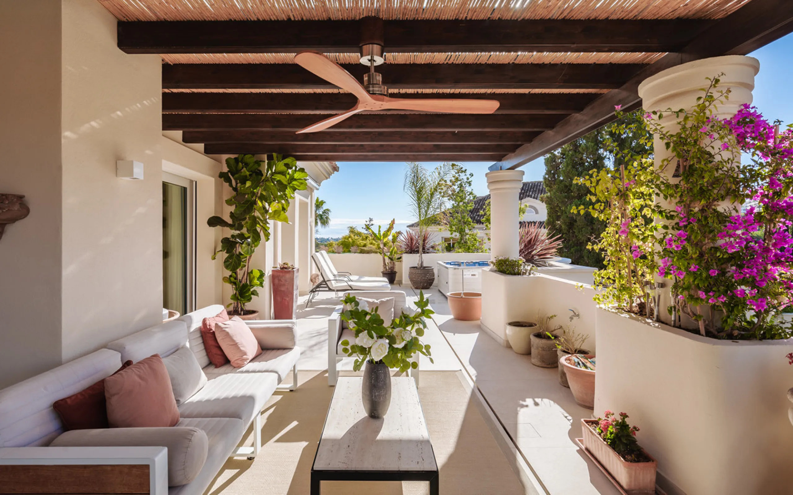 This exceptional and exquisitely designed southwest-facing duplex penthouse offers a stunning panoramic view of the award-winning gardens of Las Alamandas, in Nueva Andalucía, providing an ideal balance of sun and shade across its expansive terrace spaces