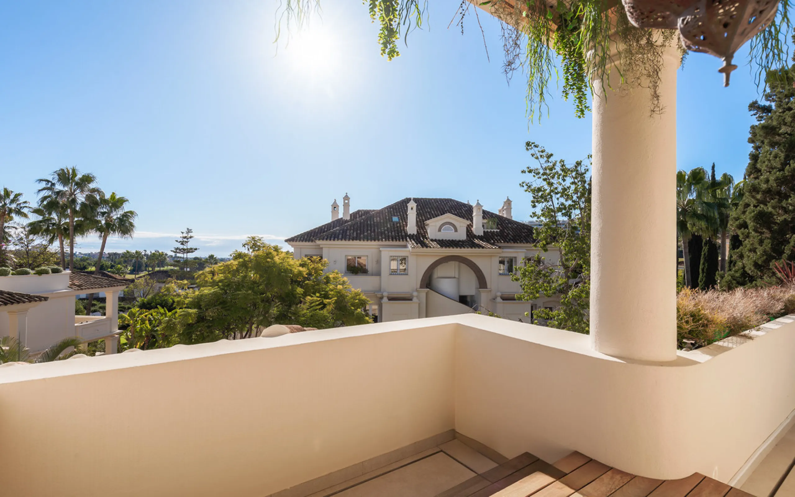 This exceptional and exquisitely designed southwest-facing duplex penthouse offers a stunning panoramic view of the award-winning gardens of Las Alamandas, in Nueva Andalucía, providing an ideal balance of sun and shade across its expansive terrace spaces