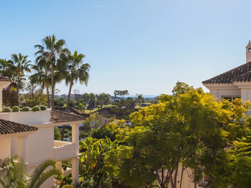 This exceptional and exquisitely designed southwest-facing duplex penthouse offers a stunning panoramic view of the award-winning gardens of Las Alamandas, in Nueva Andalucía, providing an ideal balance of sun and shade across its expansive terrace spaces