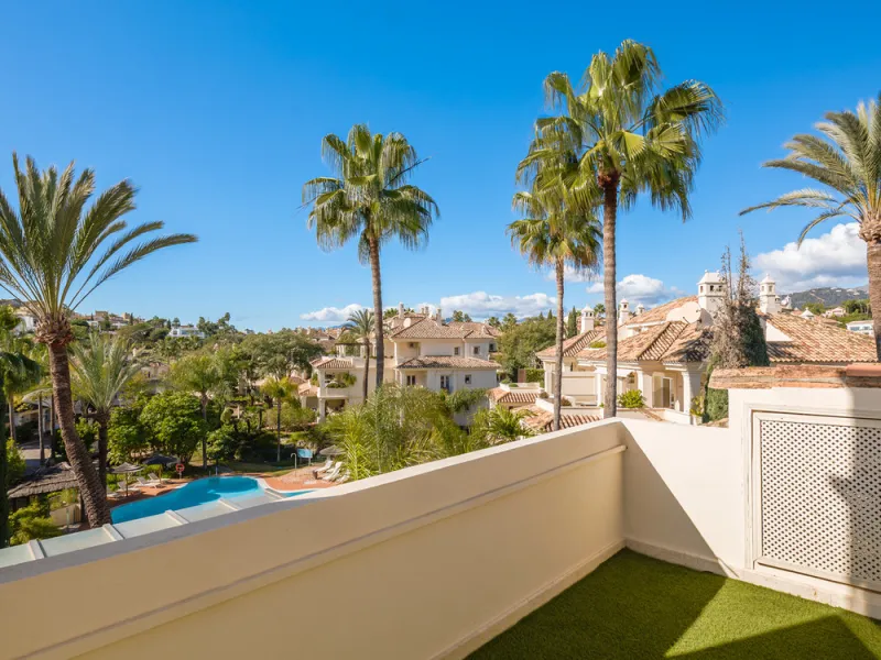This exceptional and exquisitely designed southwest-facing duplex penthouse offers a stunning panoramic view of the award-winning gardens of Las Alamandas, in Nueva Andalucía, providing an ideal balance of sun and shade across its expansive terrace spaces