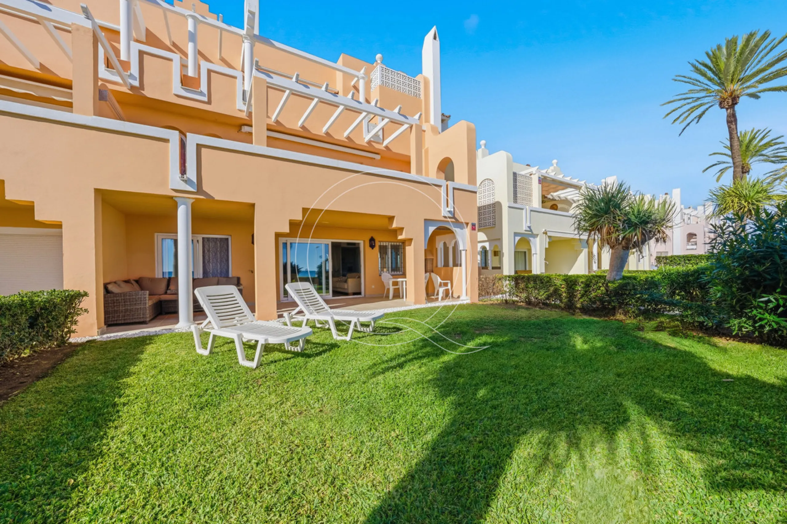Located in a prestigious front-line beach complex just west of Estepona, this three-bedroom ground-floor apartment offers an exceptional blend of coastal comfort and relaxed Mediterranean living. With direct access to the garden and just steps from the sa