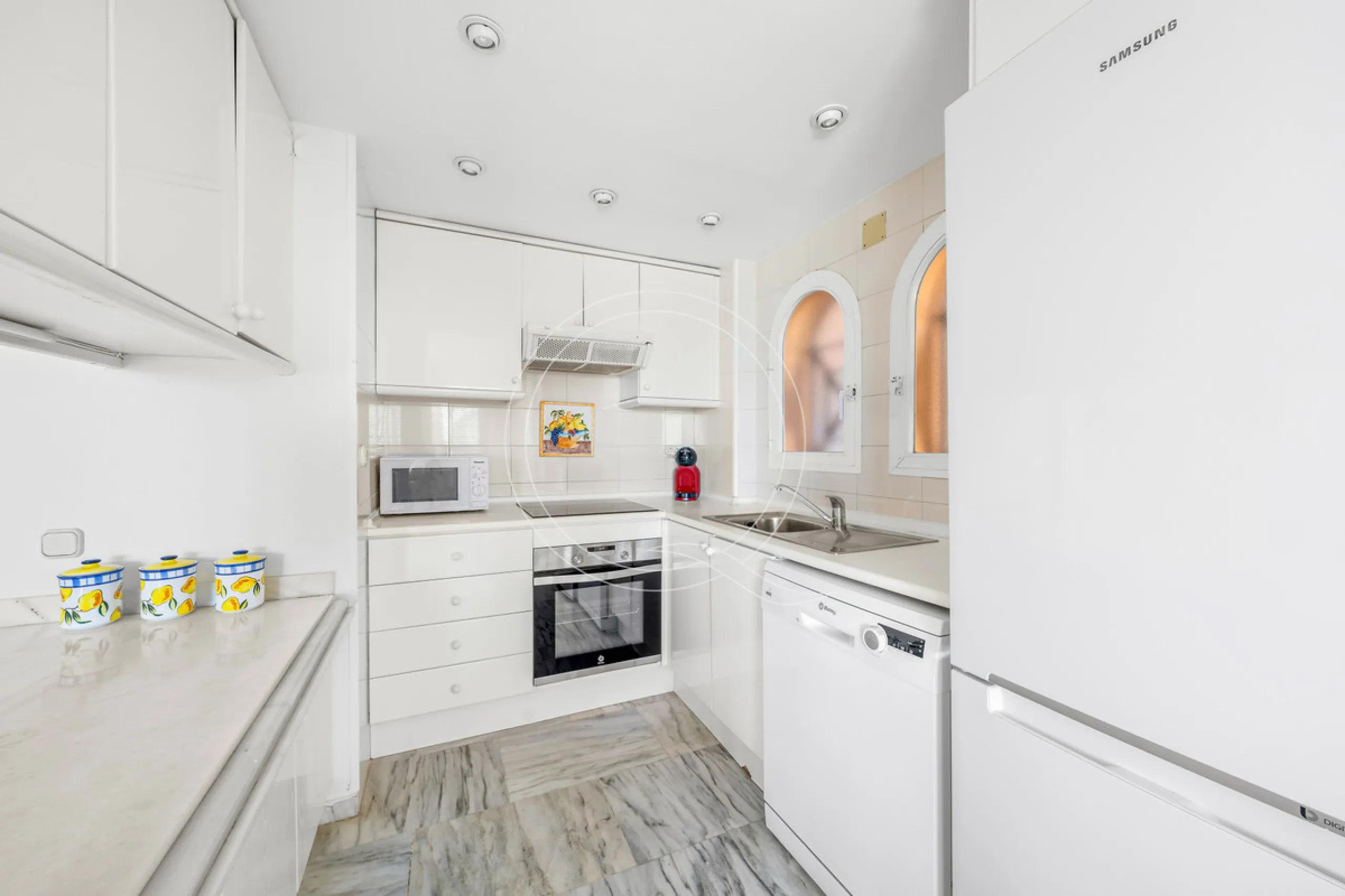 Located in a prestigious front-line beach complex just west of Estepona, this three-bedroom ground-floor apartment offers an exceptional blend of coastal comfort and relaxed Mediterranean living. With direct access to the garden and just steps from the sa