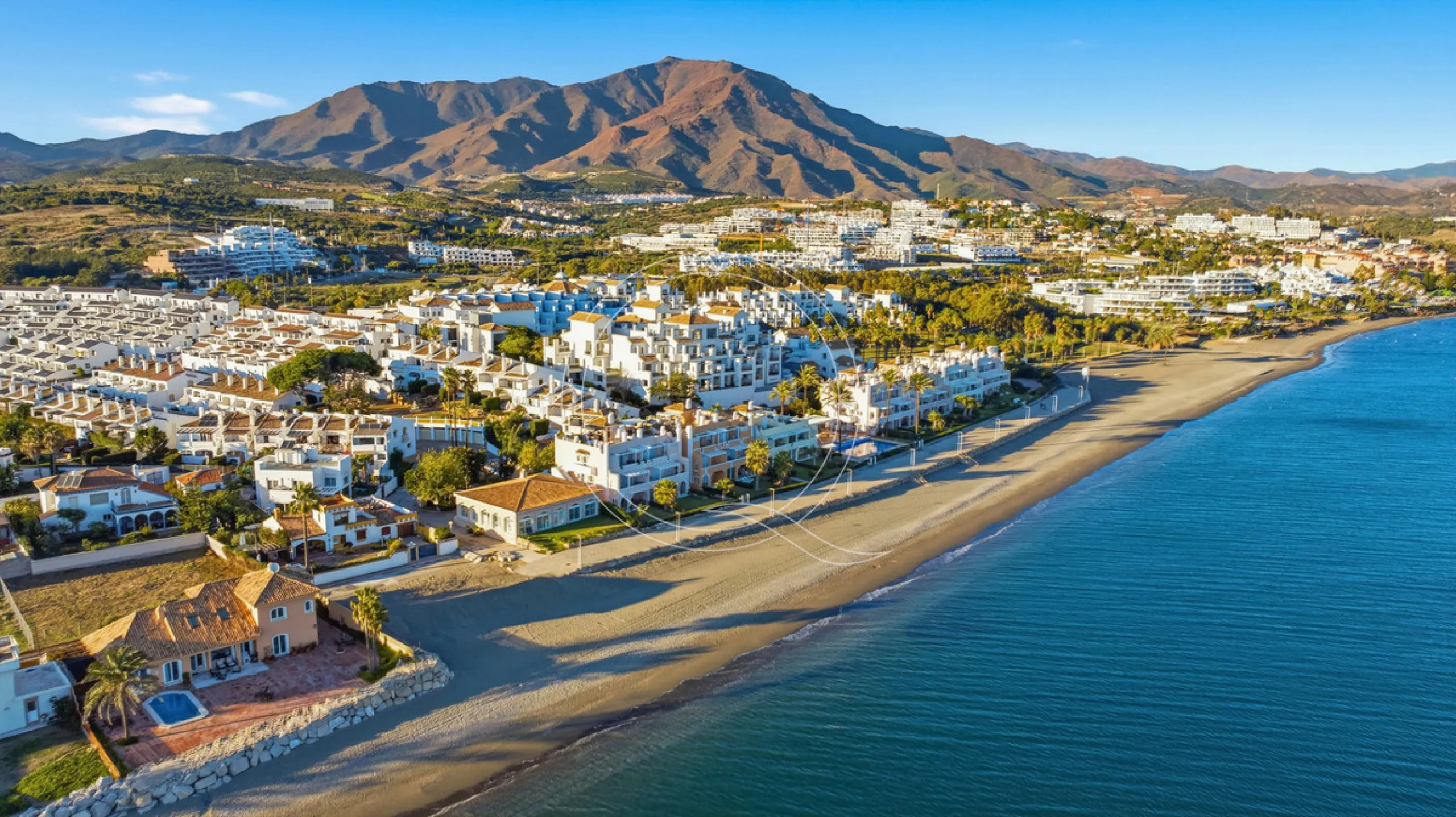 Located in a prestigious front-line beach complex just west of Estepona, this three-bedroom ground-floor apartment offers an exceptional blend of coastal comfort and relaxed Mediterranean living. With direct access to the garden and just steps from the sa
