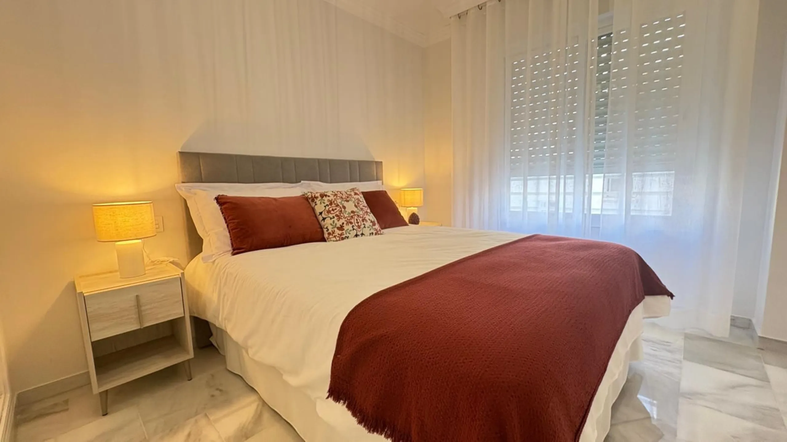 This beautifully renovated middle-floor apartment is located in one of Marbella's most sought-after areas, right in the heart of the center and just steps from the beach. Positioned on the second line of the beachfront near the lighthouse, it offers the p