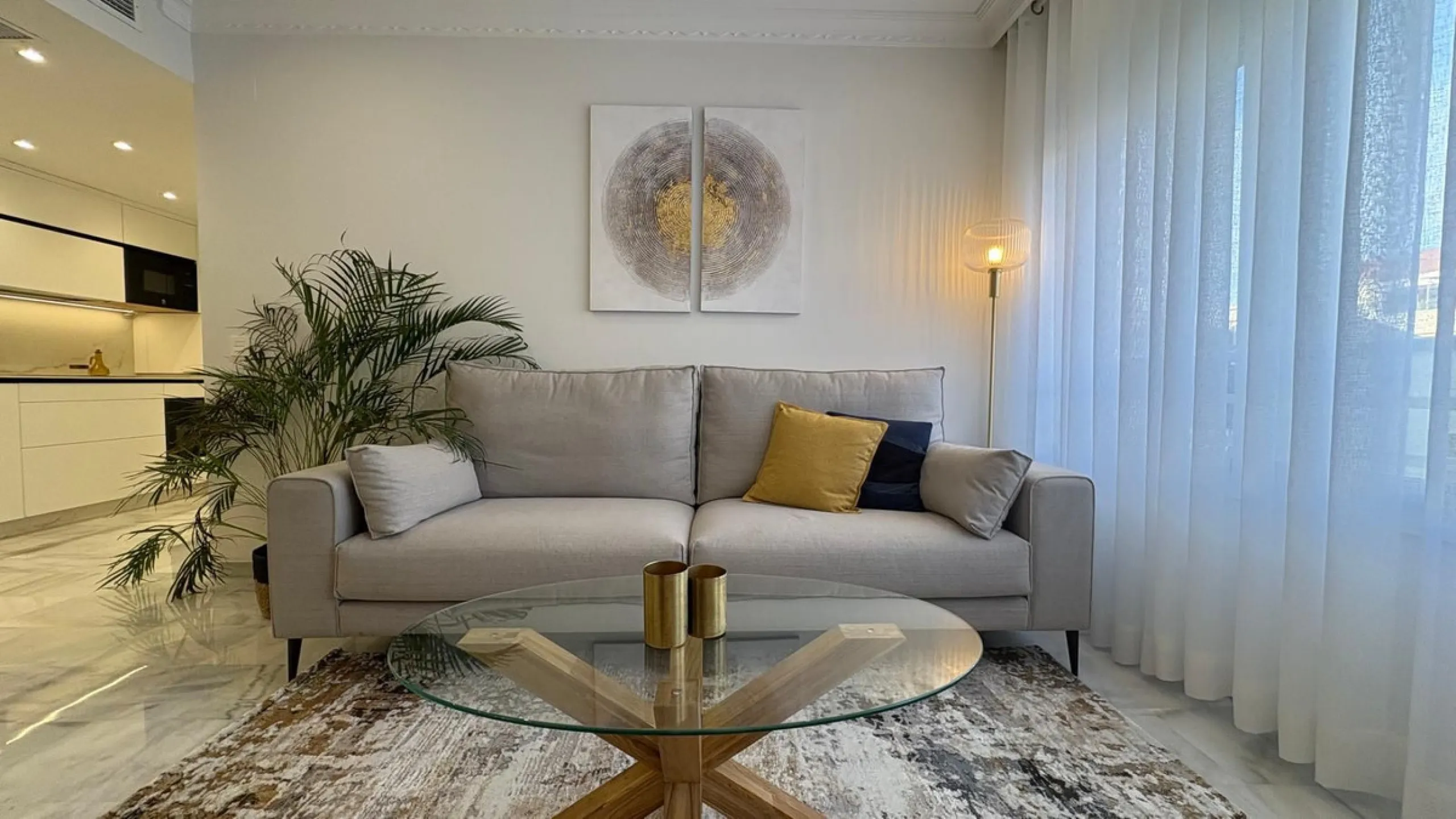 This beautifully renovated middle-floor apartment is located in one of Marbella's most sought-after areas, right in the heart of the center and just steps from the beach. Positioned on the second line of the beachfront near the lighthouse, it offers the p