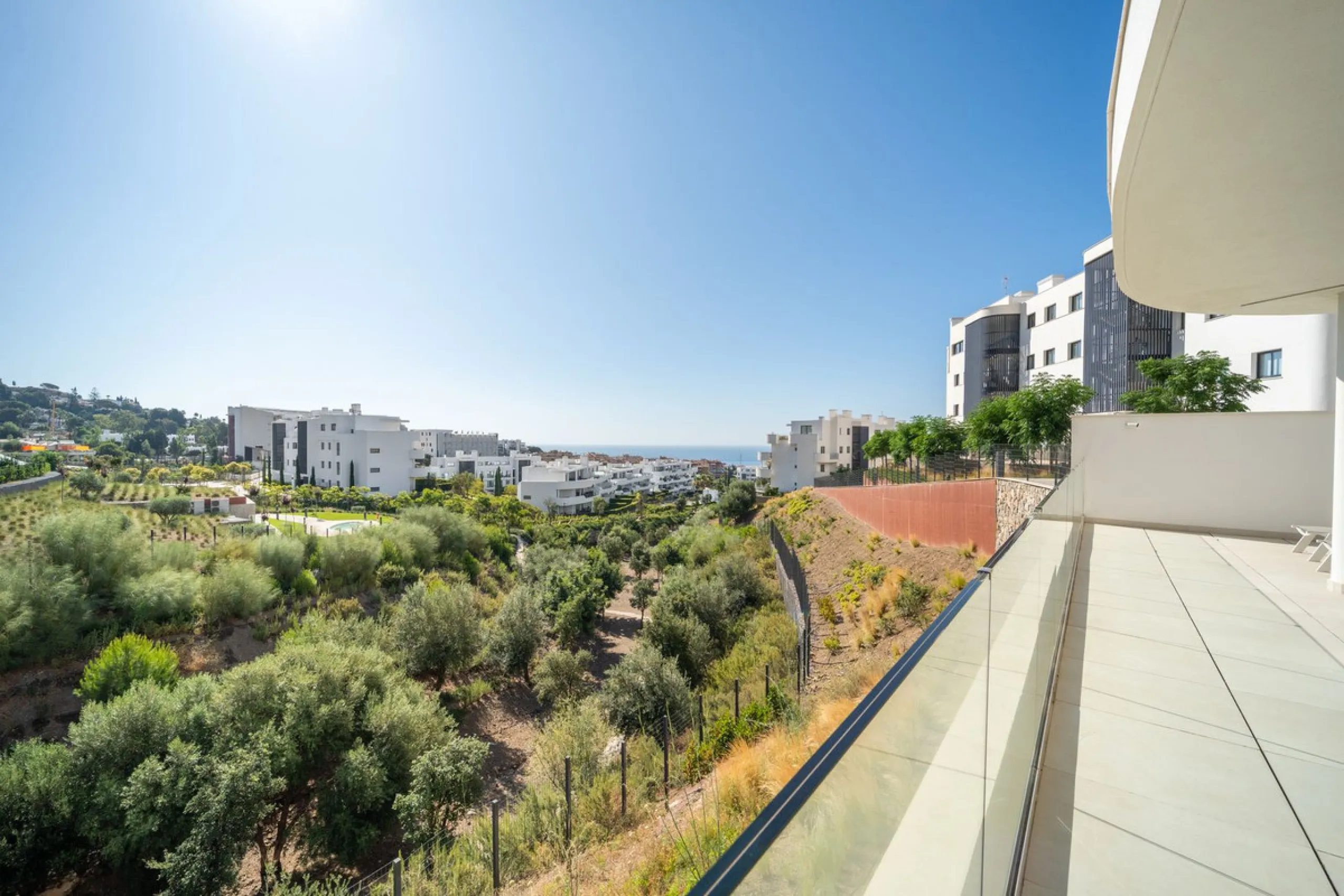 This exceptional ground-floor apartment offers a rare combination of space, privacy, and open views within a secure and highly sought-after residential setting on the Costa del Sol. The property enjoys uninterrupted views over a protected green zone and w