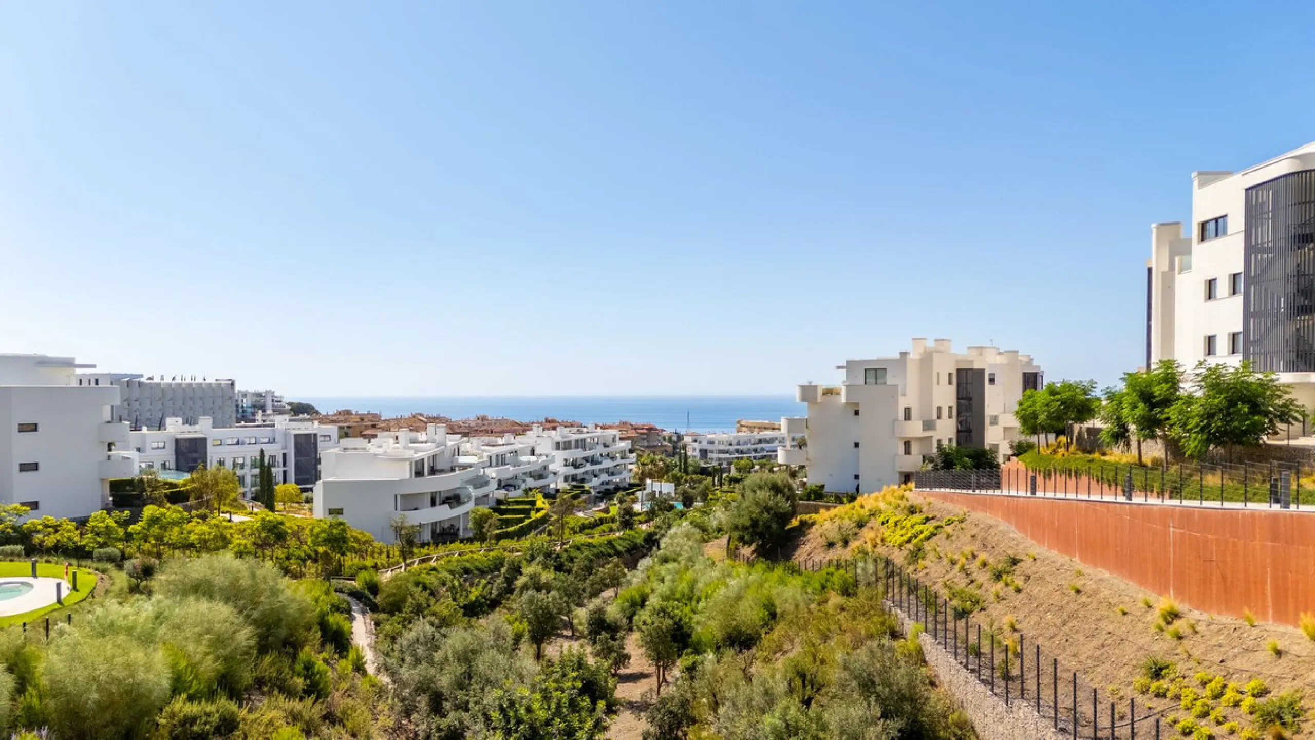 This exceptional ground-floor apartment offers a rare combination of space, privacy, and open views within a secure and highly sought-after residential setting on the Costa del Sol. The property enjoys uninterrupted views over a protected green zone and w