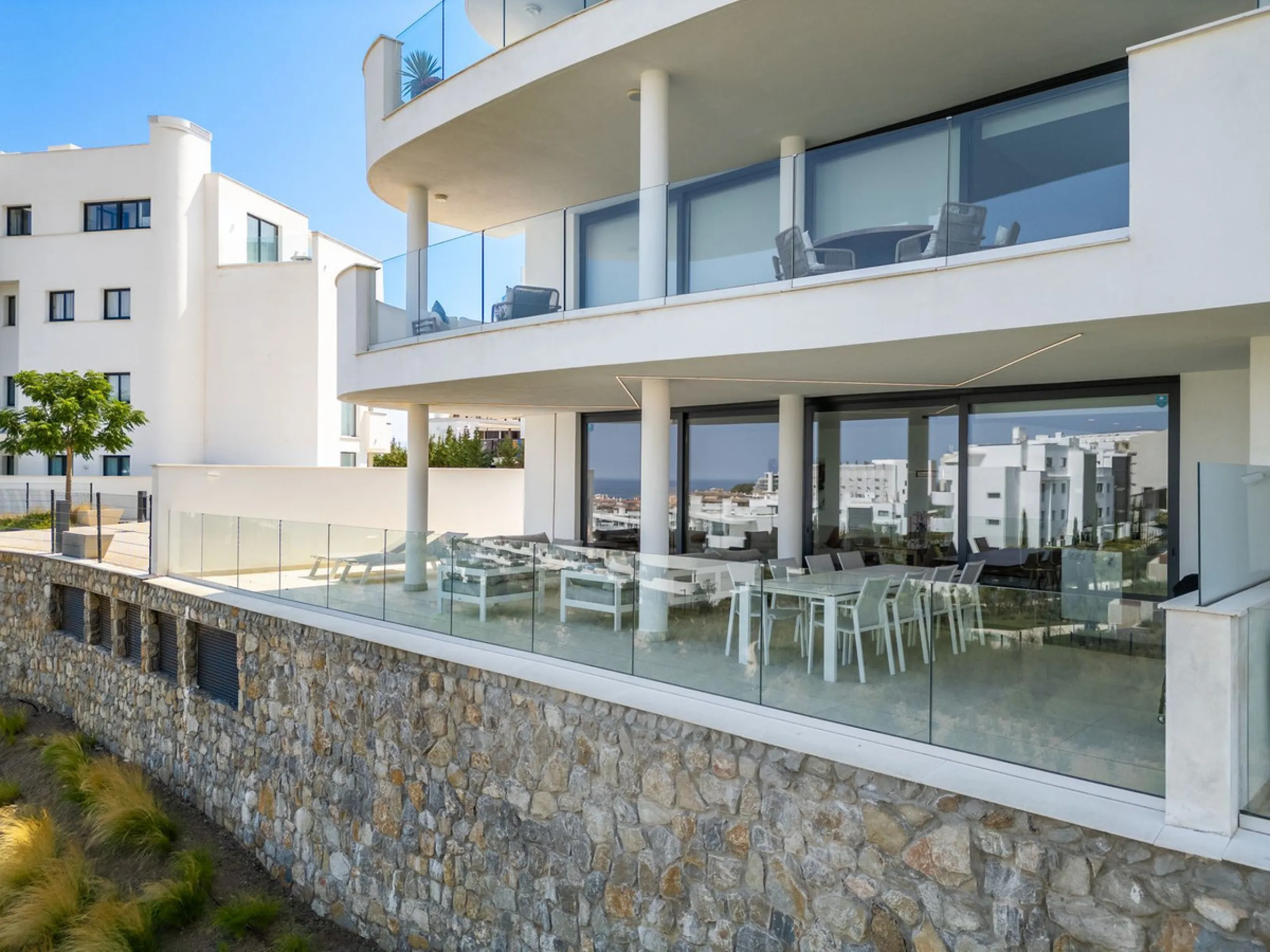 This exceptional ground-floor apartment offers a rare combination of space, privacy, and open views within a secure and highly sought-after residential setting on the Costa del Sol. The property enjoys uninterrupted views over a protected green zone and w