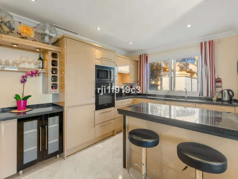 Discover a truly exceptional home in the prestigious Elviria Hills complex. Originally a two-bedroom apartment, converted into a modern three-bedroom property that combines contemporary design, comfort, and some of the best panoramic sea views in the area