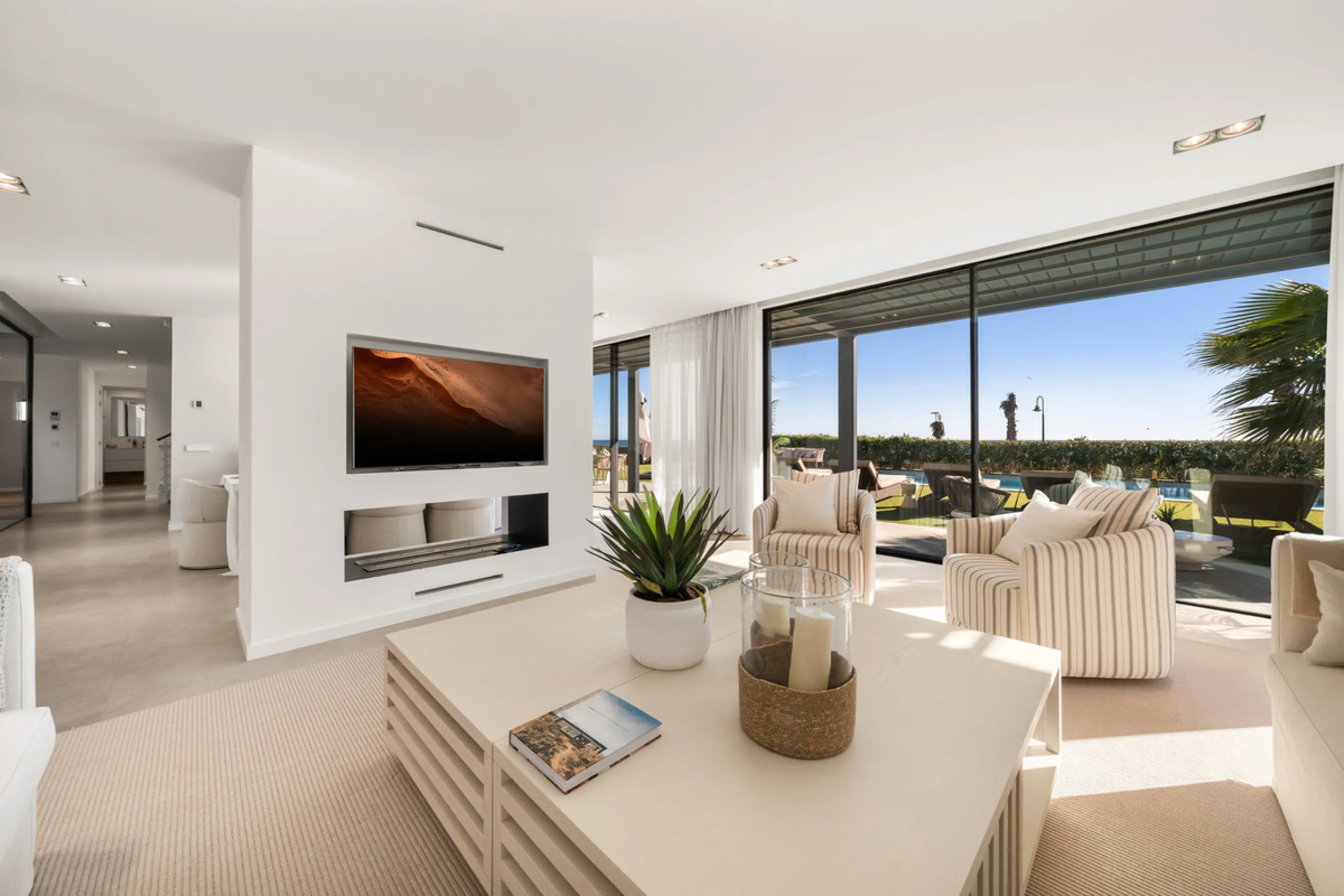 Boasting of panoramic sea views, a contemporary showpiece villa sitting in a privileged beachfront position in the New Golden Mile, surrounded by an expansive private garden with a large private swimming pool. The ideal family estate offering a dynamic ou