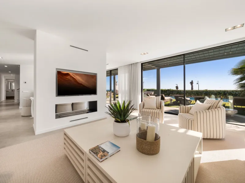 Boasting of panoramic sea views, a contemporary showpiece villa sitting in a privileged beachfront position in the New Golden Mile, surrounded by an expansive private garden with a large private swimming pool. The ideal family estate offering a dynamic ou