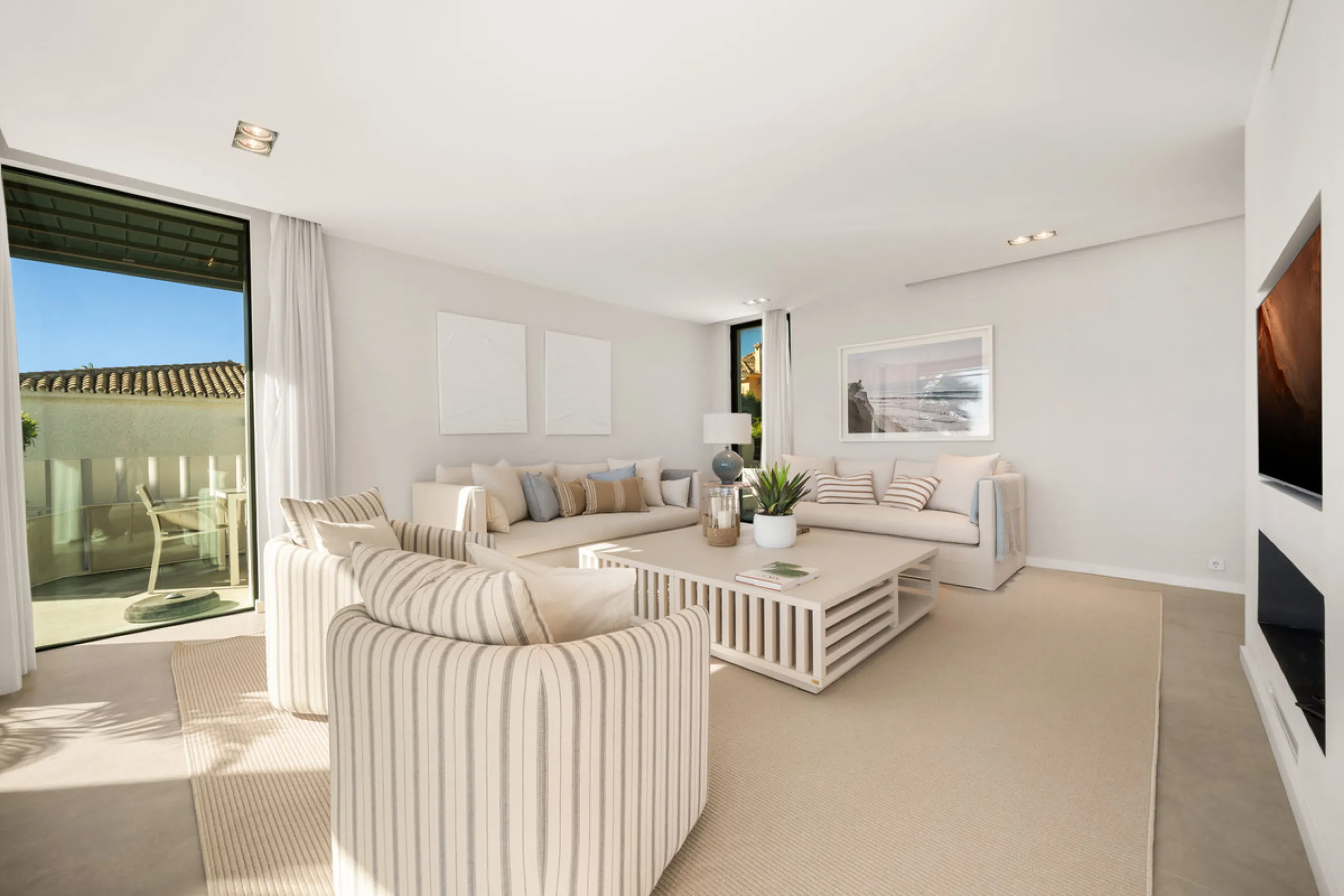 Boasting of panoramic sea views, a contemporary showpiece villa sitting in a privileged beachfront position in the New Golden Mile, surrounded by an expansive private garden with a large private swimming pool. The ideal family estate offering a dynamic ou
