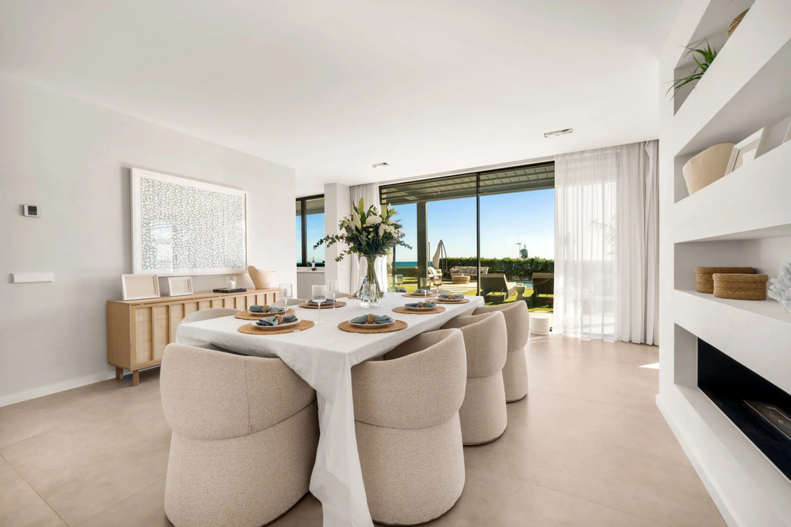 Boasting of panoramic sea views, a contemporary showpiece villa sitting in a privileged beachfront position in the New Golden Mile, surrounded by an expansive private garden with a large private swimming pool. The ideal family estate offering a dynamic ou