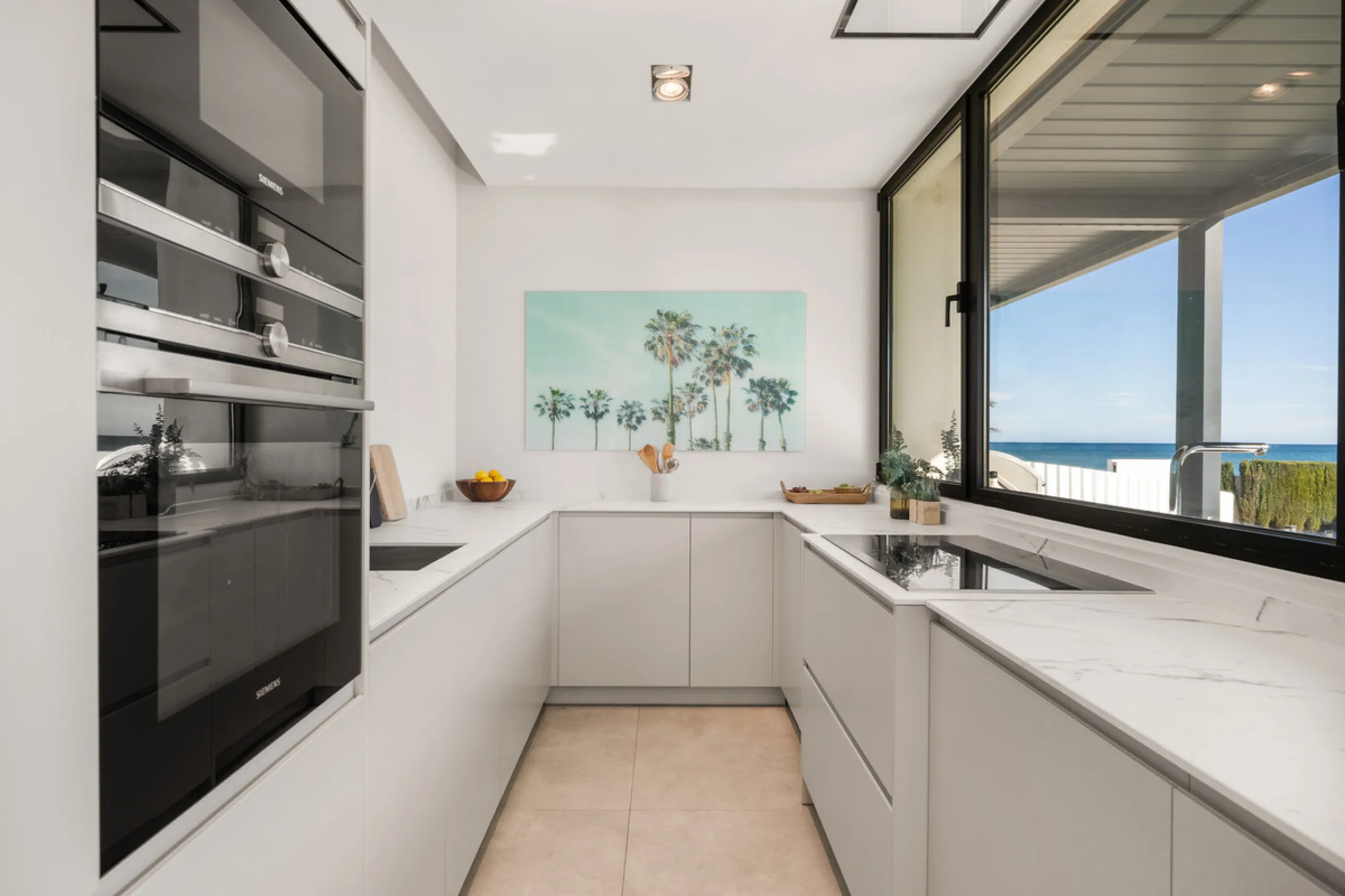 Boasting of panoramic sea views, a contemporary showpiece villa sitting in a privileged beachfront position in the New Golden Mile, surrounded by an expansive private garden with a large private swimming pool. The ideal family estate offering a dynamic ou