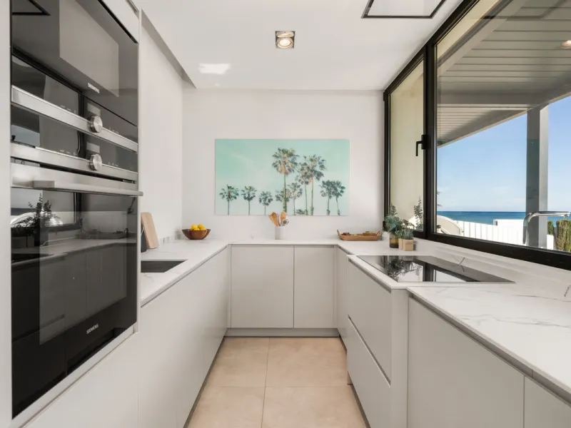 Boasting of panoramic sea views, a contemporary showpiece villa sitting in a privileged beachfront position in the New Golden Mile, surrounded by an expansive private garden with a large private swimming pool. The ideal family estate offering a dynamic ou
