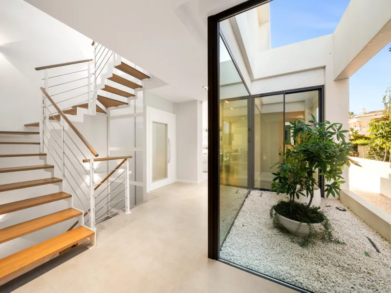 Boasting of panoramic sea views, a contemporary showpiece villa sitting in a privileged beachfront position in the New Golden Mile, surrounded by an expansive private garden with a large private swimming pool. The ideal family estate offering a dynamic ou