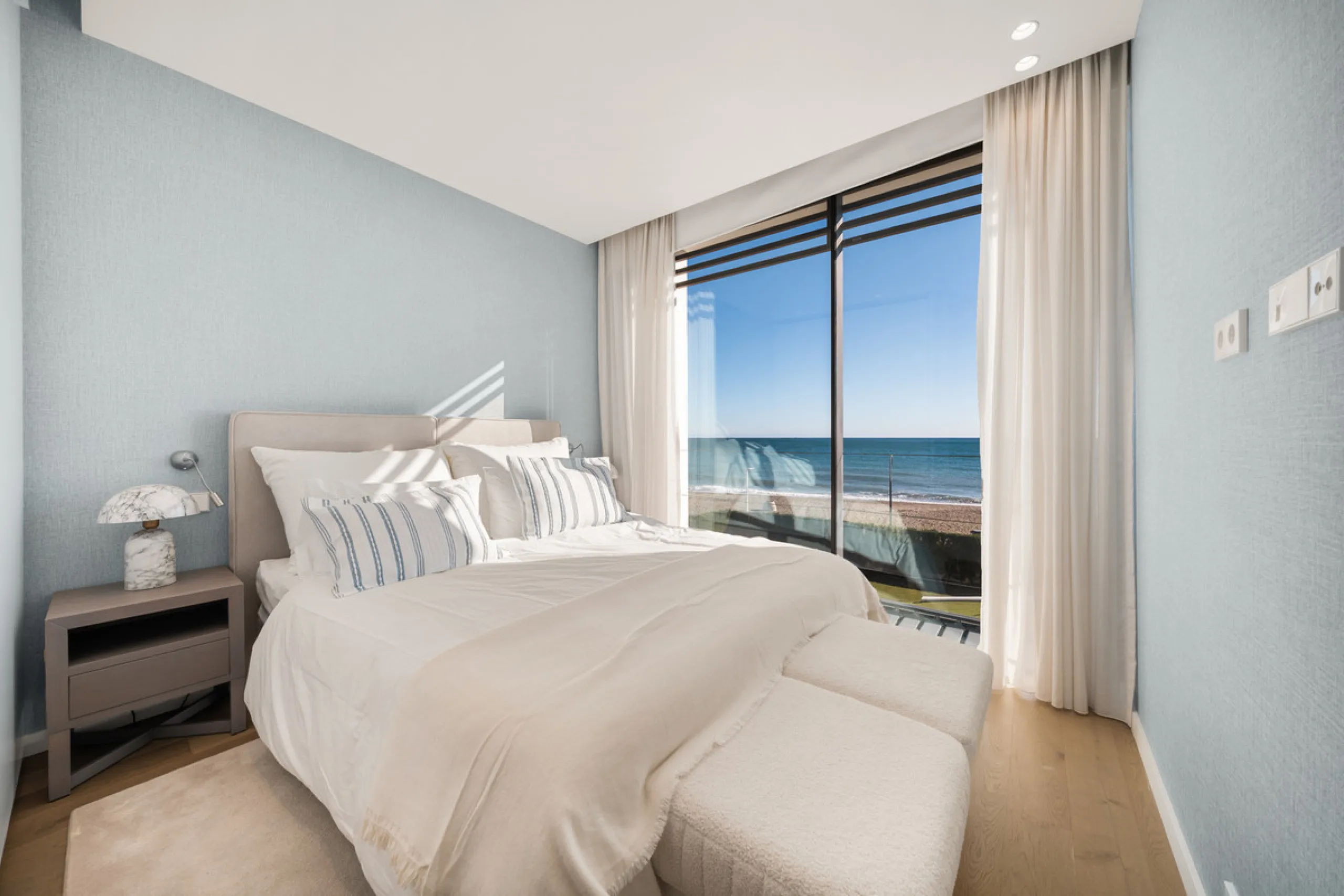 Boasting of panoramic sea views, a contemporary showpiece villa sitting in a privileged beachfront position in the New Golden Mile, surrounded by an expansive private garden with a large private swimming pool. The ideal family estate offering a dynamic ou