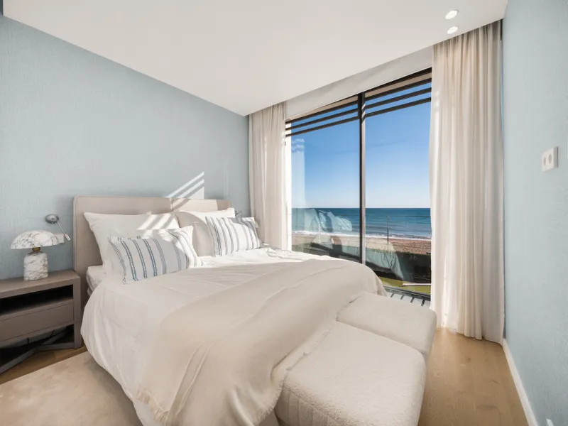 Boasting of panoramic sea views, a contemporary showpiece villa sitting in a privileged beachfront position in the New Golden Mile, surrounded by an expansive private garden with a large private swimming pool. The ideal family estate offering a dynamic ou