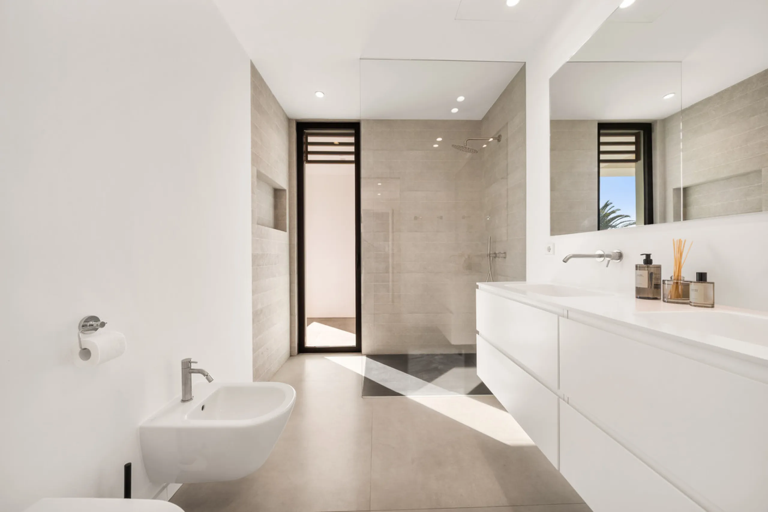 Boasting of panoramic sea views, a contemporary showpiece villa sitting in a privileged beachfront position in the New Golden Mile, surrounded by an expansive private garden with a large private swimming pool. The ideal family estate offering a dynamic ou