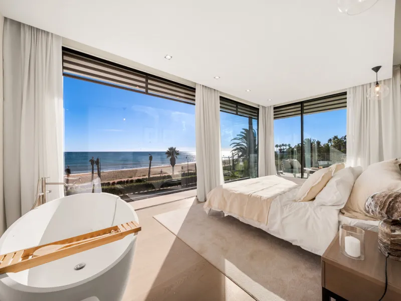 Boasting of panoramic sea views, a contemporary showpiece villa sitting in a privileged beachfront position in the New Golden Mile, surrounded by an expansive private garden with a large private swimming pool. The ideal family estate offering a dynamic ou