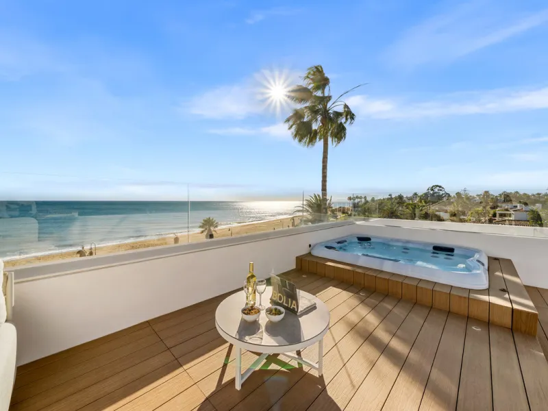 Boasting of panoramic sea views, a contemporary showpiece villa sitting in a privileged beachfront position in the New Golden Mile, surrounded by an expansive private garden with a large private swimming pool. The ideal family estate offering a dynamic ou