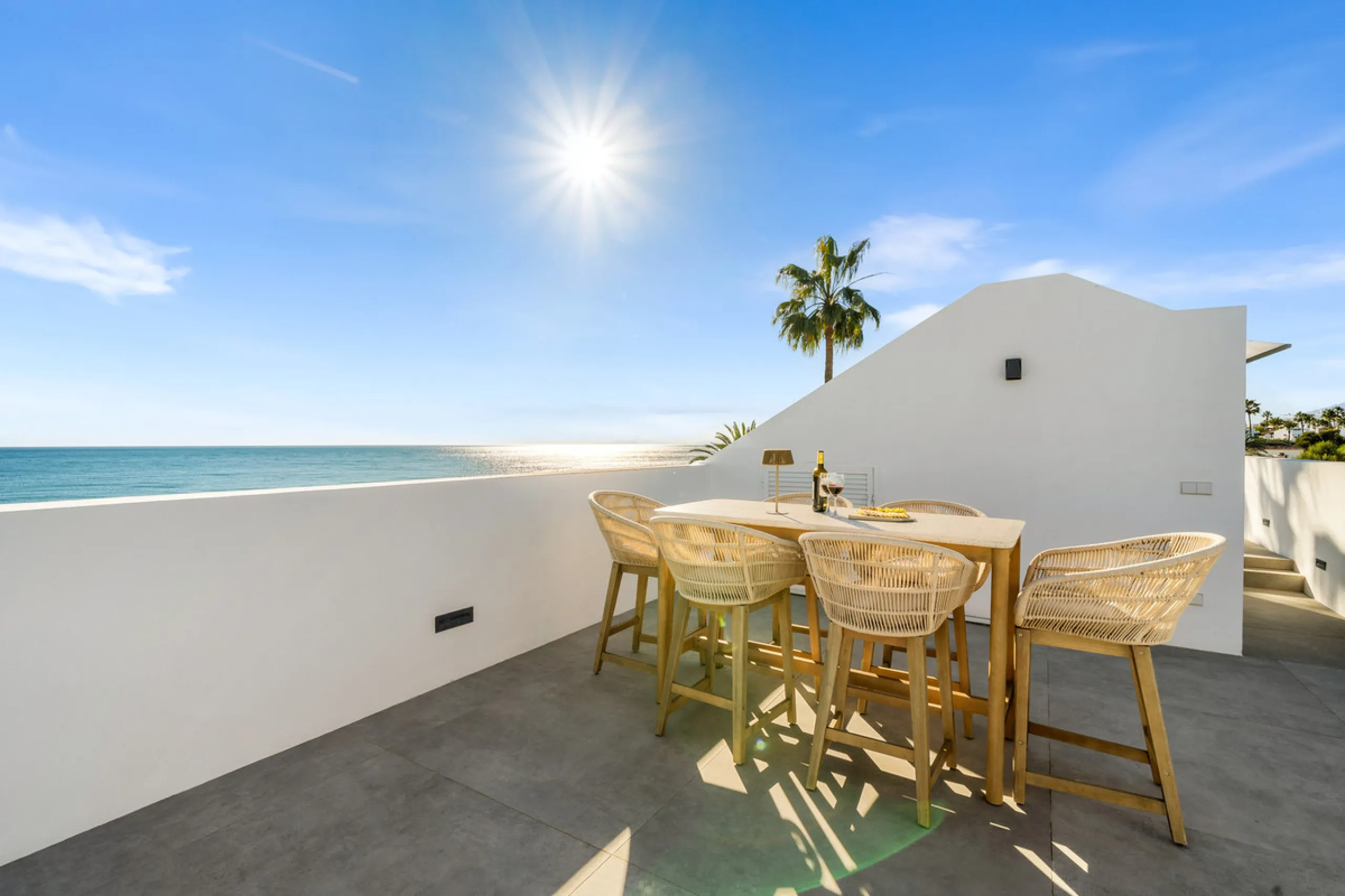 Boasting of panoramic sea views, a contemporary showpiece villa sitting in a privileged beachfront position in the New Golden Mile, surrounded by an expansive private garden with a large private swimming pool. The ideal family estate offering a dynamic ou