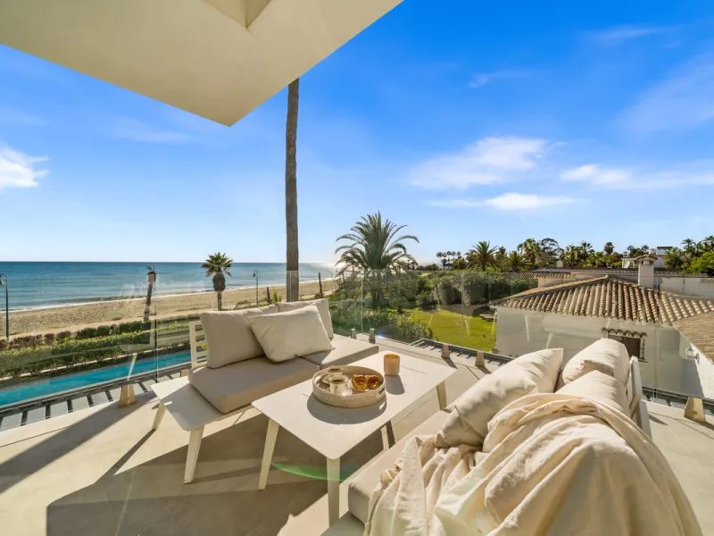 Boasting of panoramic sea views, a contemporary showpiece villa sitting in a privileged beachfront position in the New Golden Mile, surrounded by an expansive private garden with a large private swimming pool. The ideal family estate offering a dynamic ou