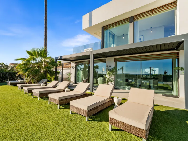 Boasting of panoramic sea views, a contemporary showpiece villa sitting in a privileged beachfront position in the New Golden Mile, surrounded by an expansive private garden with a large private swimming pool. The ideal family estate offering a dynamic ou