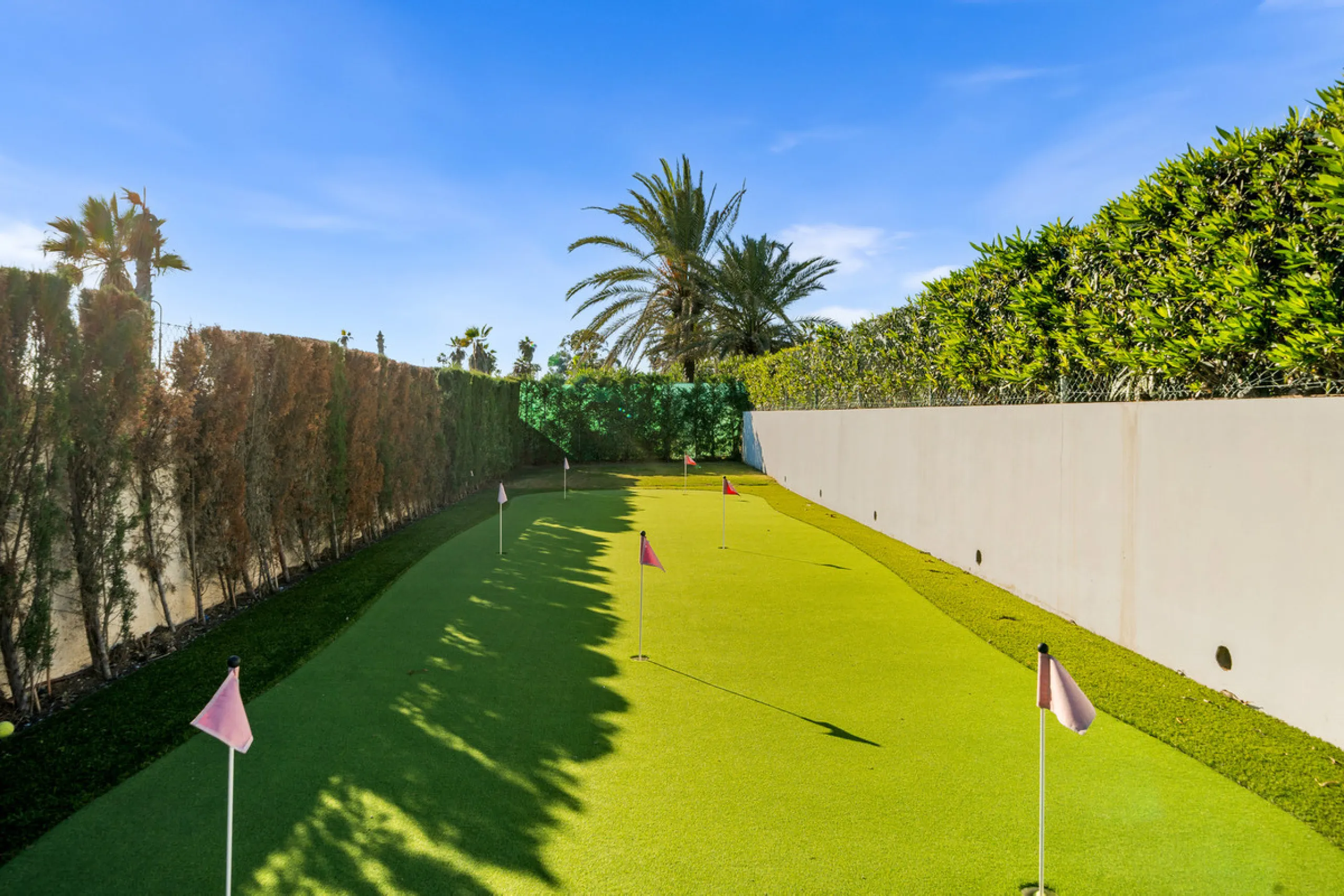 Boasting of panoramic sea views, a contemporary showpiece villa sitting in a privileged beachfront position in the New Golden Mile, surrounded by an expansive private garden with a large private swimming pool. The ideal family estate offering a dynamic ou