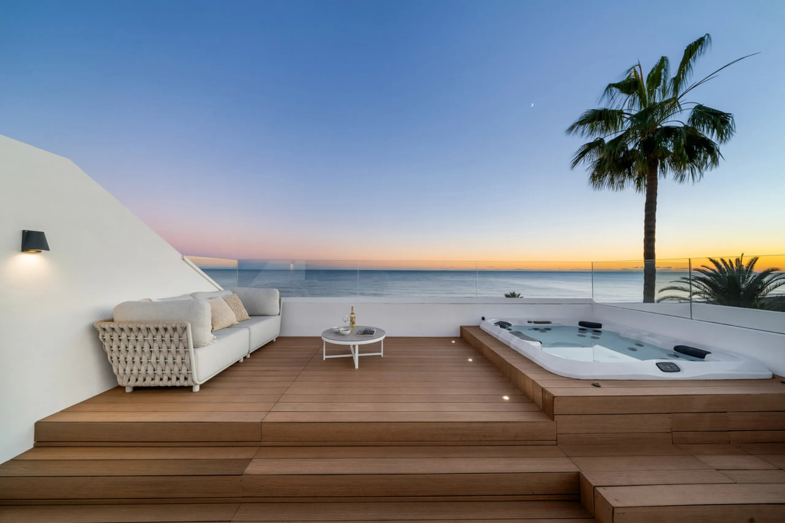 Boasting of panoramic sea views, a contemporary showpiece villa sitting in a privileged beachfront position in the New Golden Mile, surrounded by an expansive private garden with a large private swimming pool. The ideal family estate offering a dynamic ou