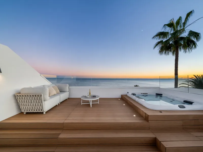 Boasting of panoramic sea views, a contemporary showpiece villa sitting in a privileged beachfront position in the New Golden Mile, surrounded by an expansive private garden with a large private swimming pool. The ideal family estate offering a dynamic ou